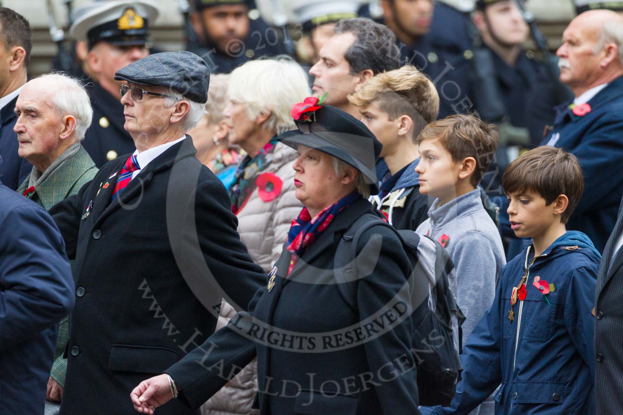 Remembrance Sunday at the Cenotaph 2015: Group M23, Civilians Representing Families.
Cenotaph, Whitehall, London SW1,
London,
Greater London,
United Kingdom,
on 08 November 2015 at 12:17, image #1560