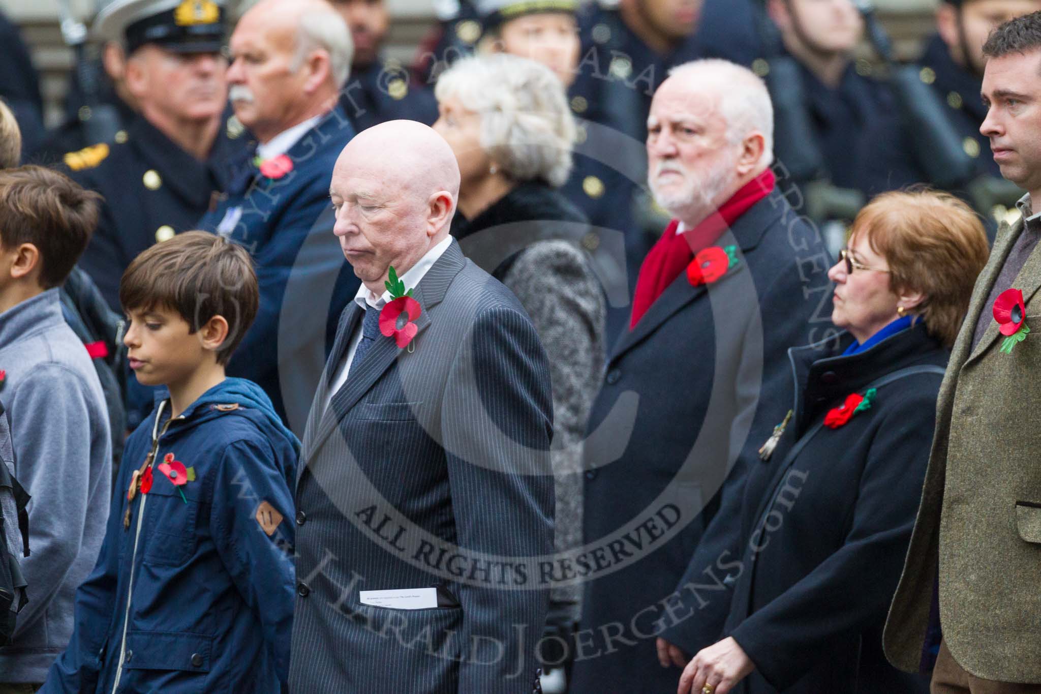 Remembrance Sunday at the Cenotaph 2015: Group M23, Civilians Representing Families.
Cenotaph, Whitehall, London SW1,
London,
Greater London,
United Kingdom,
on 08 November 2015 at 12:17, image #1562