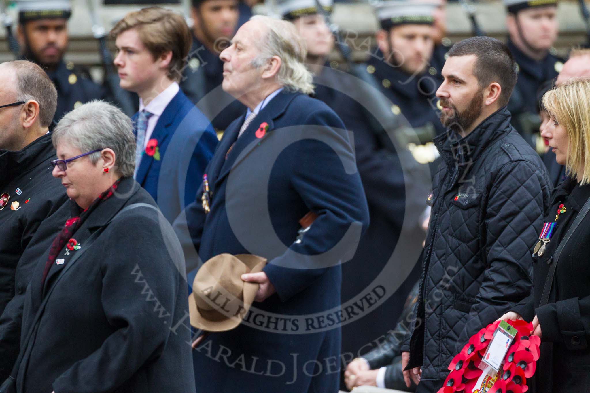 Remembrance Sunday at the Cenotaph 2015: Group M23, Civilians Representing Families.
Cenotaph, Whitehall, London SW1,
London,
Greater London,
United Kingdom,
on 08 November 2015 at 12:17, image #1575