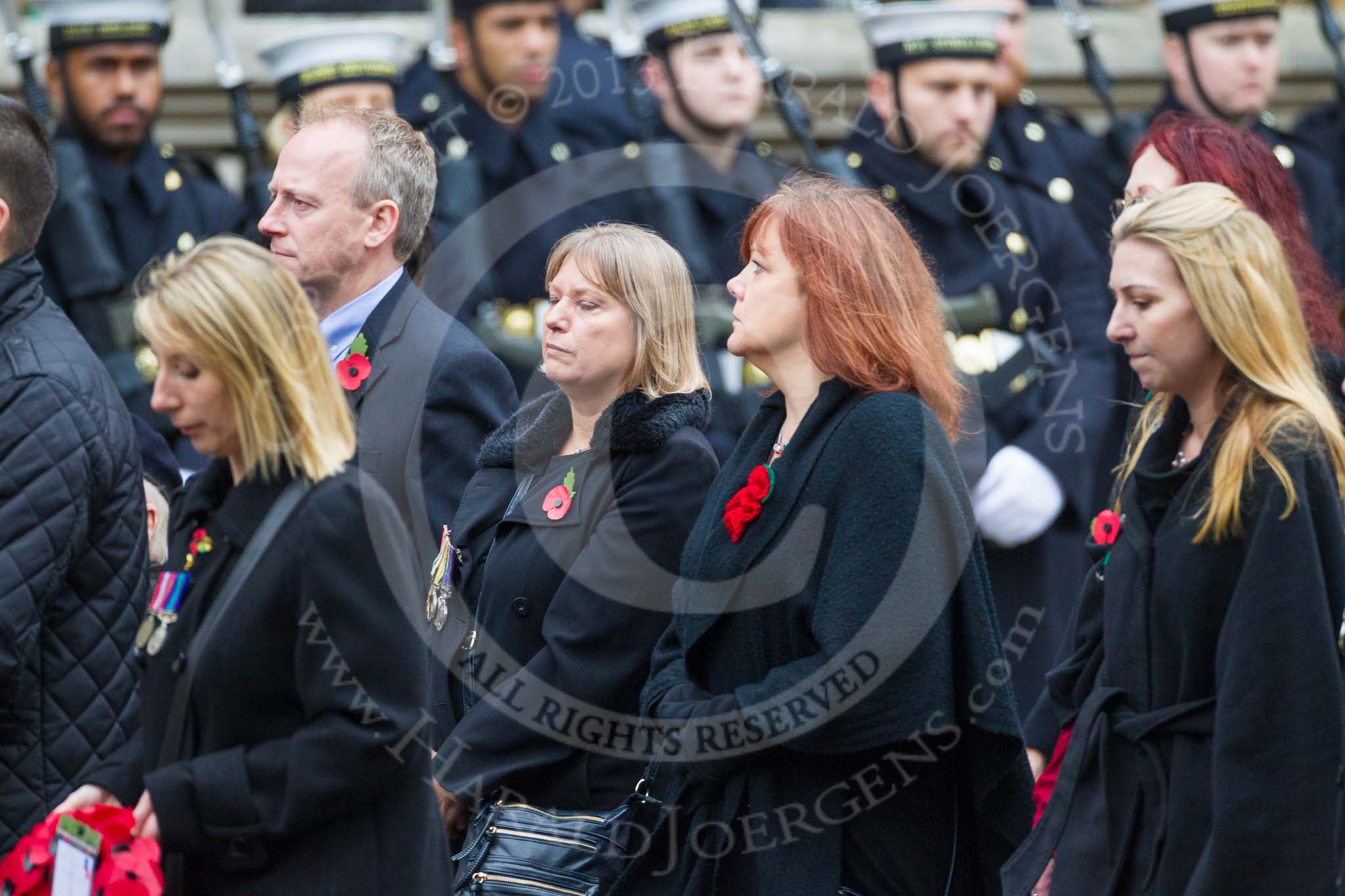 Remembrance Sunday at the Cenotaph 2015: Group M23, Civilians Representing Families.
Cenotaph, Whitehall, London SW1,
London,
Greater London,
United Kingdom,
on 08 November 2015 at 12:17, image #1577