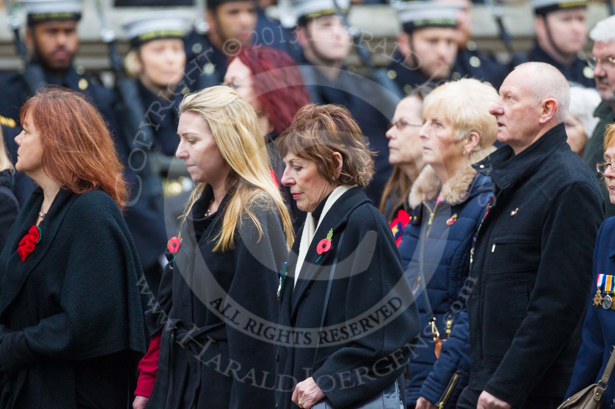 Remembrance Sunday at the Cenotaph 2015: Group M23, Civilians Representing Families.
Cenotaph, Whitehall, London SW1,
London,
Greater London,
United Kingdom,
on 08 November 2015 at 12:17, image #1578