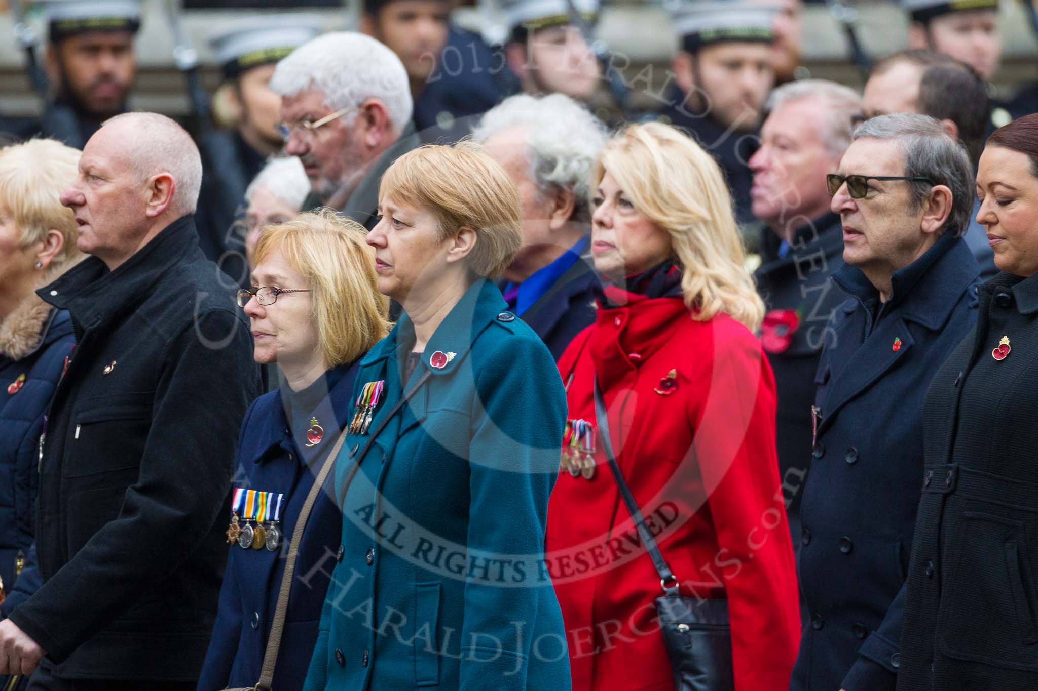 Remembrance Sunday at the Cenotaph 2015: Group M23, Civilians Representing Families.
Cenotaph, Whitehall, London SW1,
London,
Greater London,
United Kingdom,
on 08 November 2015 at 12:17, image #1579