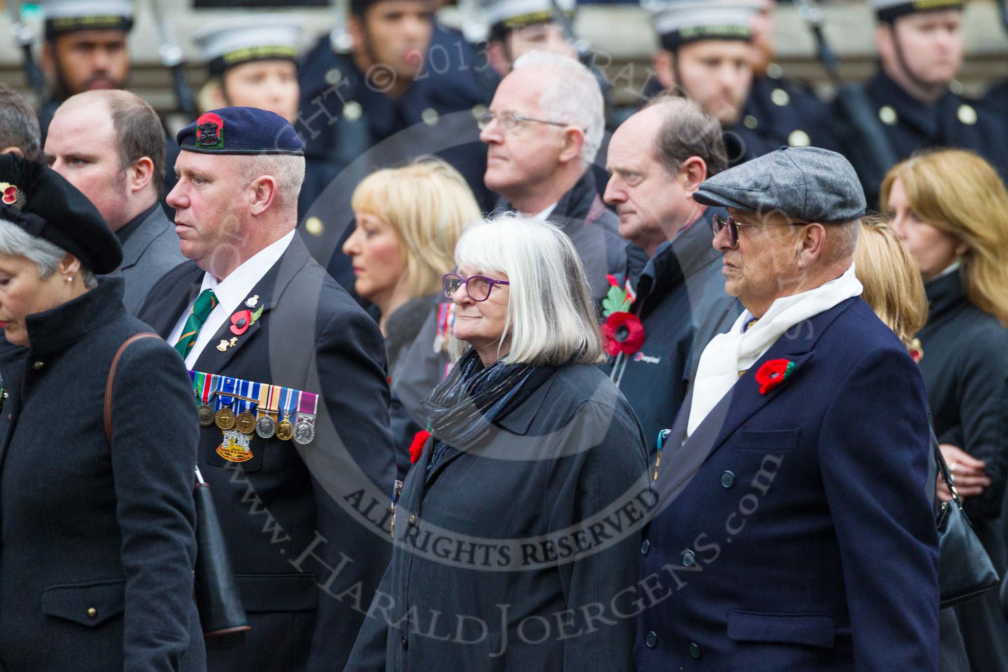 Remembrance Sunday at the Cenotaph 2015: Group M23, Civilians Representing Families.
Cenotaph, Whitehall, London SW1,
London,
Greater London,
United Kingdom,
on 08 November 2015 at 12:17, image #1583