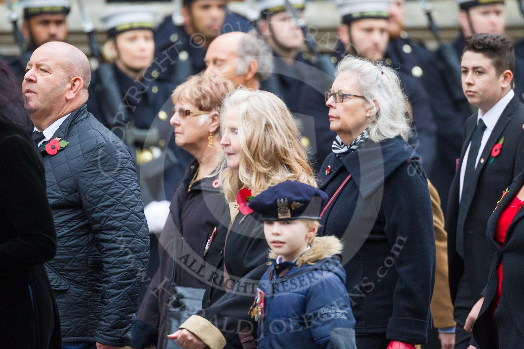 Remembrance Sunday at the Cenotaph 2015: Group M23, Civilians Representing Families.
Cenotaph, Whitehall, London SW1,
London,
Greater London,
United Kingdom,
on 08 November 2015 at 12:17, image #1586