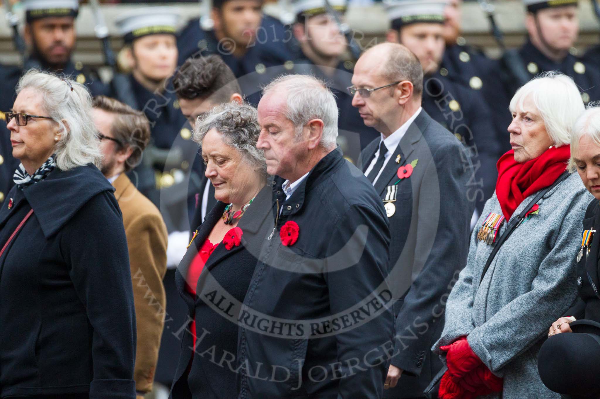 Remembrance Sunday at the Cenotaph 2015: Group M23, Civilians Representing Families.
Cenotaph, Whitehall, London SW1,
London,
Greater London,
United Kingdom,
on 08 November 2015 at 12:17, image #1587