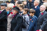 Remembrance Sunday at the Cenotaph 2015: Group M23, Civilians Representing Families.
Cenotaph, Whitehall, London SW1,
London,
Greater London,
United Kingdom,
on 08 November 2015 at 12:17, image #1561