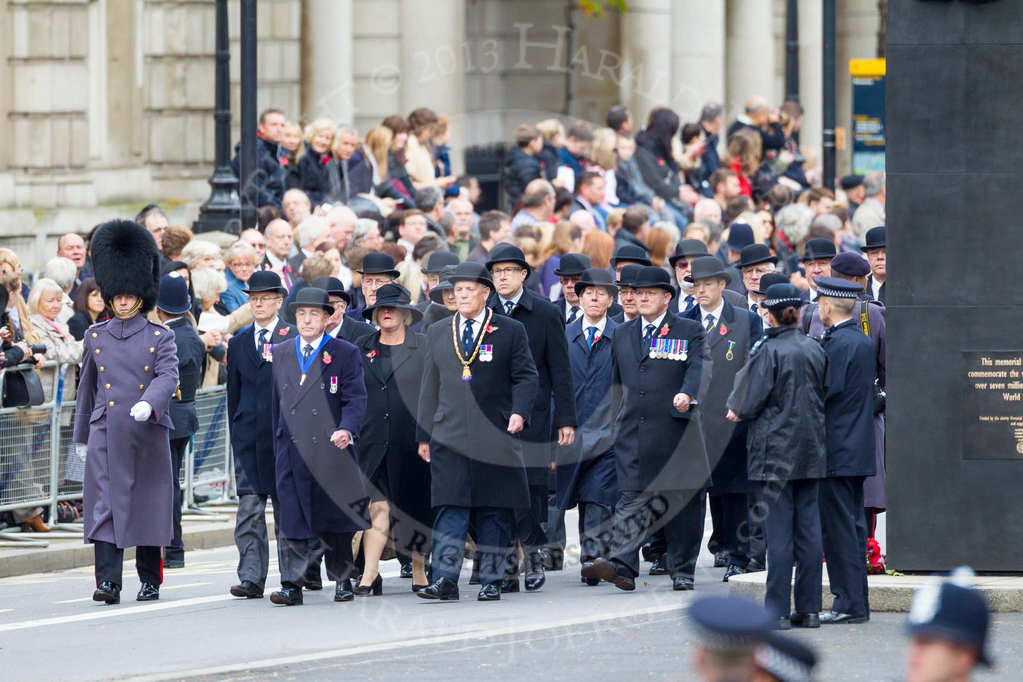 Remembrance Sunday at the Cenotaph 2015: The first column of veterans marching along Whitehall, passing the Memorial for Women in World War II. Image #24, 08 November 2015 10:15 Whitehall, London, UK
