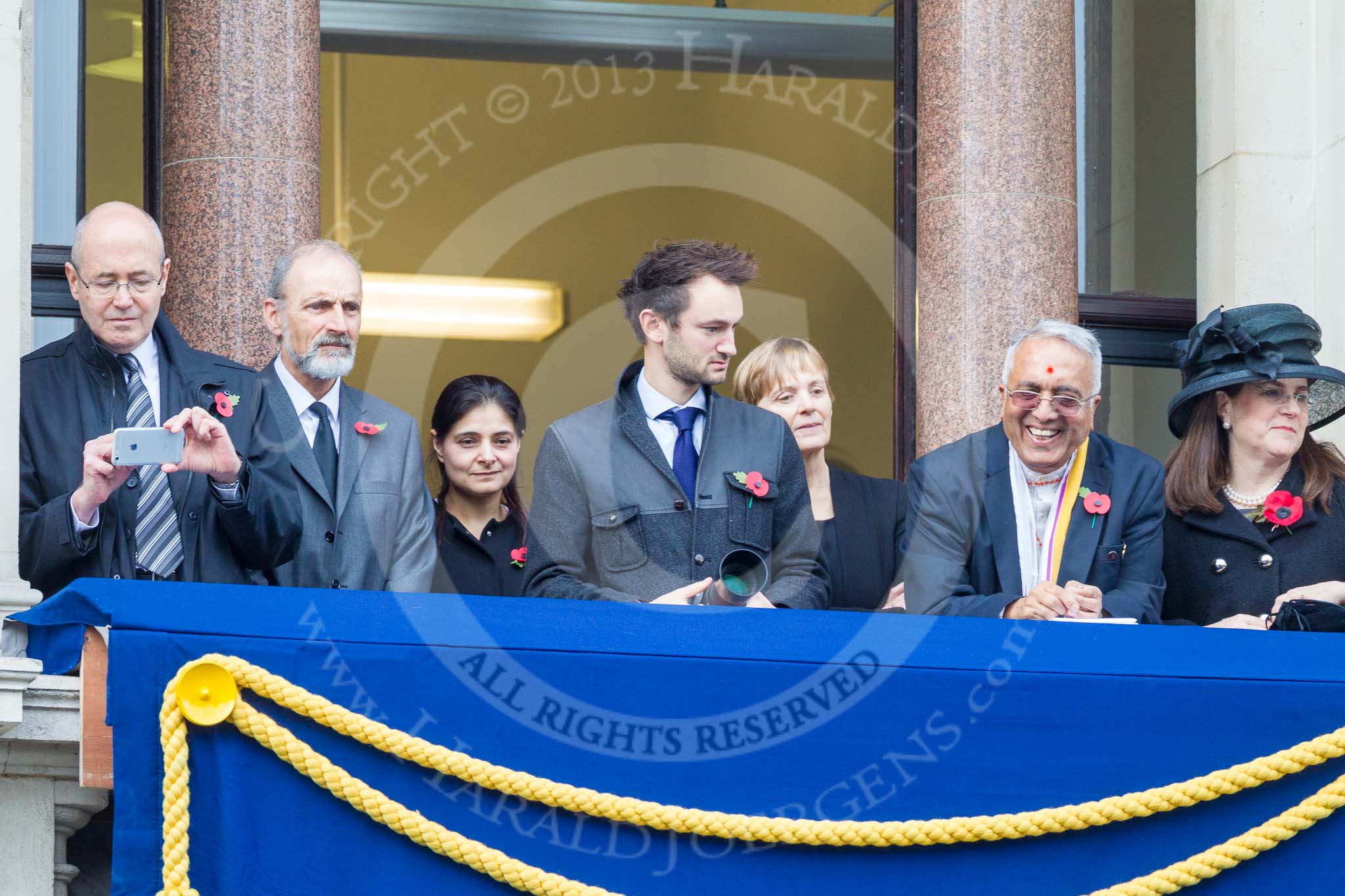 Remembrance Sunday at the Cenotaph 2015: Guests on one of the balconies of the Foreign- and Commonwealth Office Building. Image #36, 08 November 2015 10:19 Whitehall, London, UK
