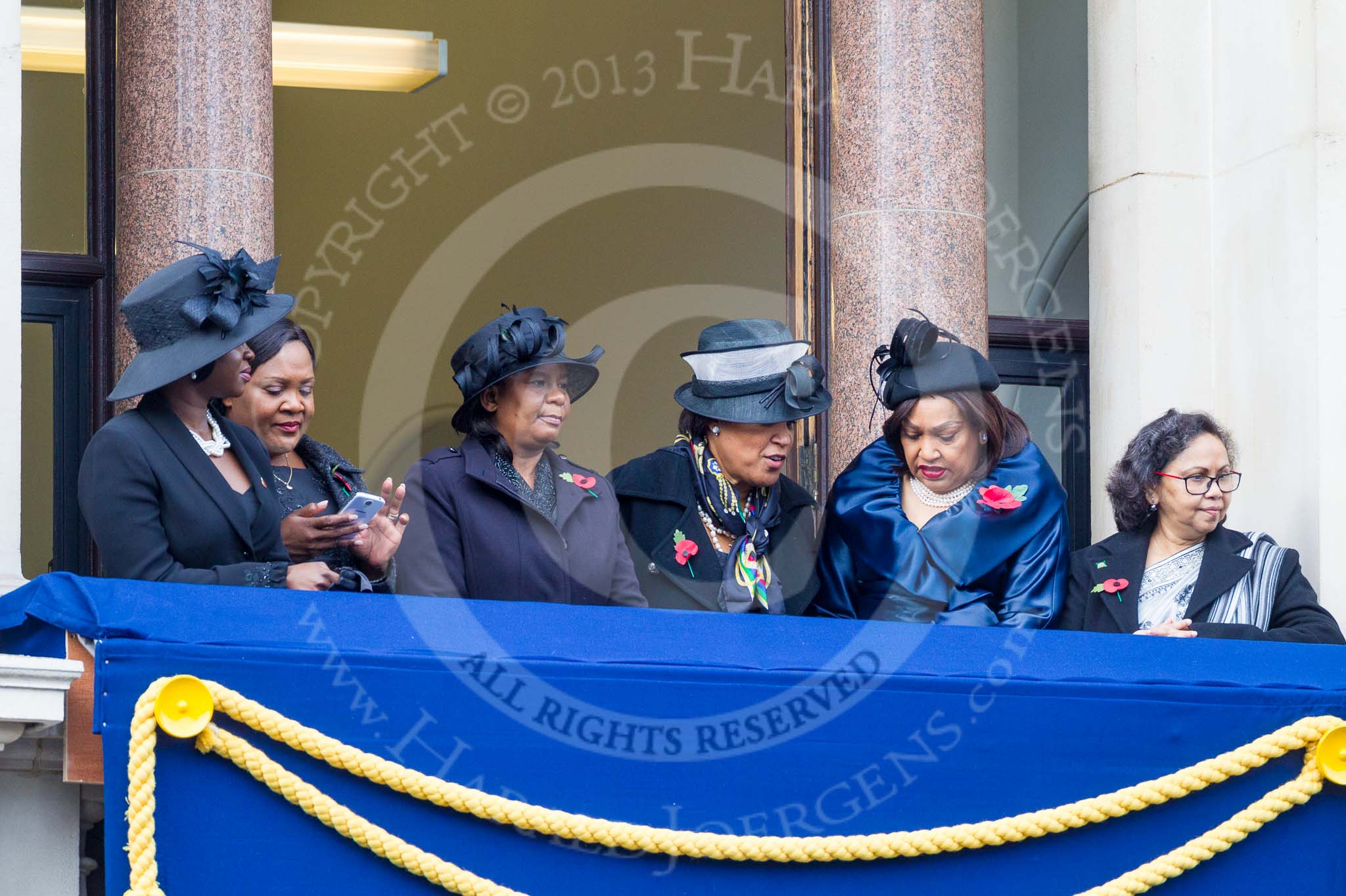 Remembrance Sunday at the Cenotaph 2015: Guests on one of the balconies of the Foreign- and Commonwealth Office Building. Image #37, 08 November 2015 10:19 Whitehall, London, UK