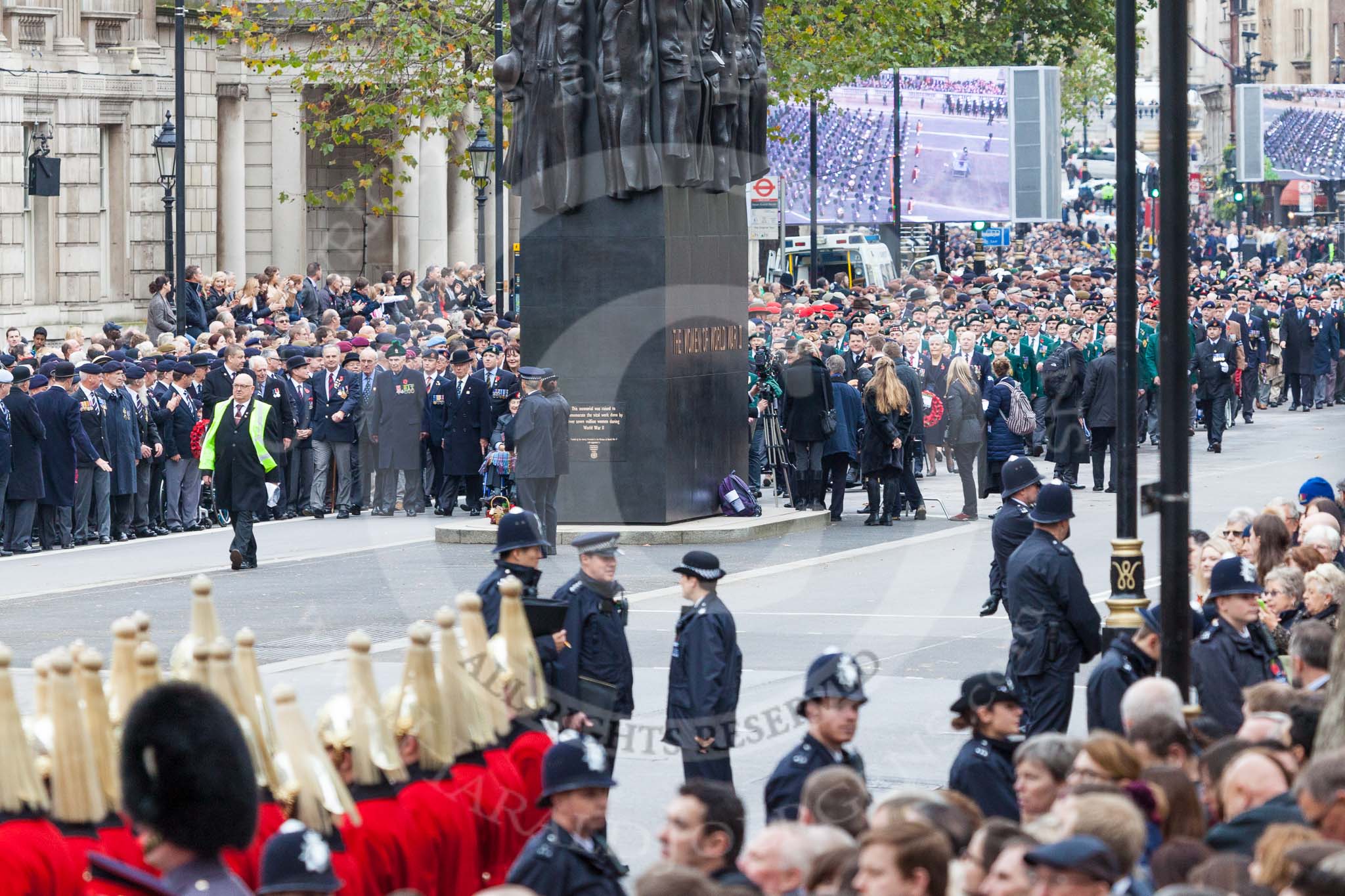 Remembrance Sunday at the Cenotaph 2015: The Memorial for Women in World War II, with the first column of veterans waiting for the March Past marching from Horse Guards Parade to Whitehall. Image #57, 08 November 2015 10:33 Whitehall, London, UK