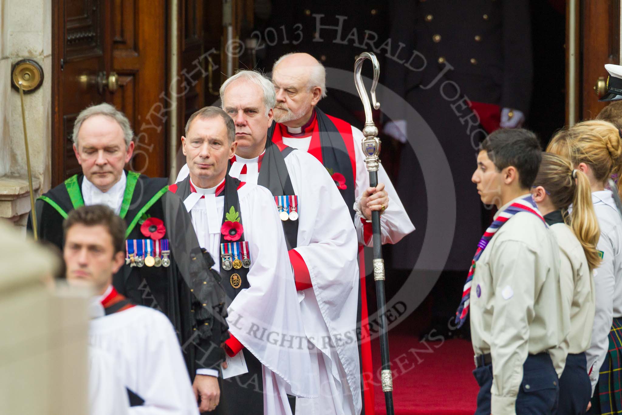 Remembrance Sunday at the Cenotaph 2015: Leaving the Foreign- and Commonwealth Building: The Serjeant of the Vestry; David Baldwin MVO RVM, the Chaplain-in-Chief of the RAF; The Venerable (Air Vice Marshal) Jonathan Chaffey QHC RAF, the Sub-Dean of Her Majesty's Chapels Royal; the Reverend Canon Paul Wright, and the Dean of HM Chapels Royal and the Lord Bishop of London; The Rt Revd. & the Rt Hon Dr Richard Chartres. Image #77, 08 November 2015 10:54 Whitehall, London, UK