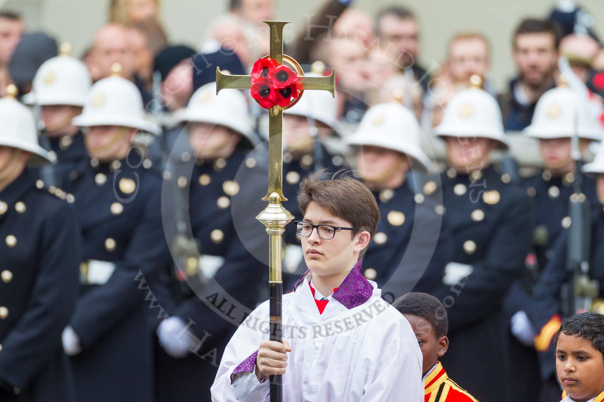 Remembrance Sunday at the Cenotaph 2015: The choir is led by the Cross Bearer, Jason Panagiotopoulos. Image #78, 08 November 2015 10:54 Whitehall, London, UK