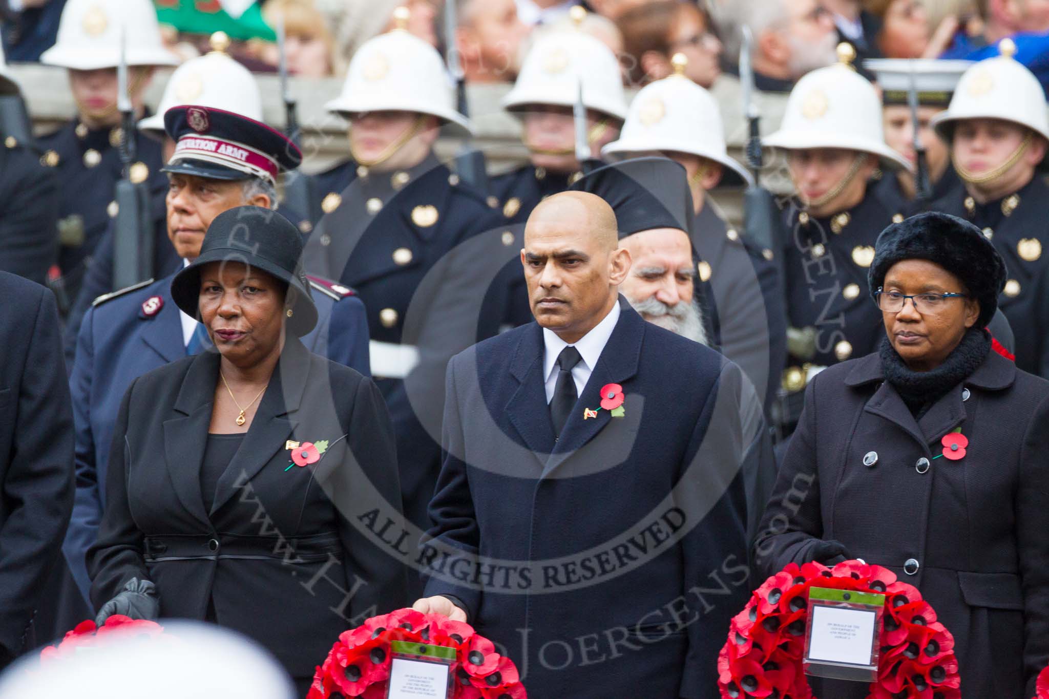 Remembrance Sunday at the Cenotaph 2015: The High Commissioner of Uganda, the Acting High Commissioner of Trinidad and Tobago, and the Minister Counsellor of Jamaica  with their wreaths at the Cenotaph. Image #112, 08 November 2015 10:57 Whitehall, London, UK