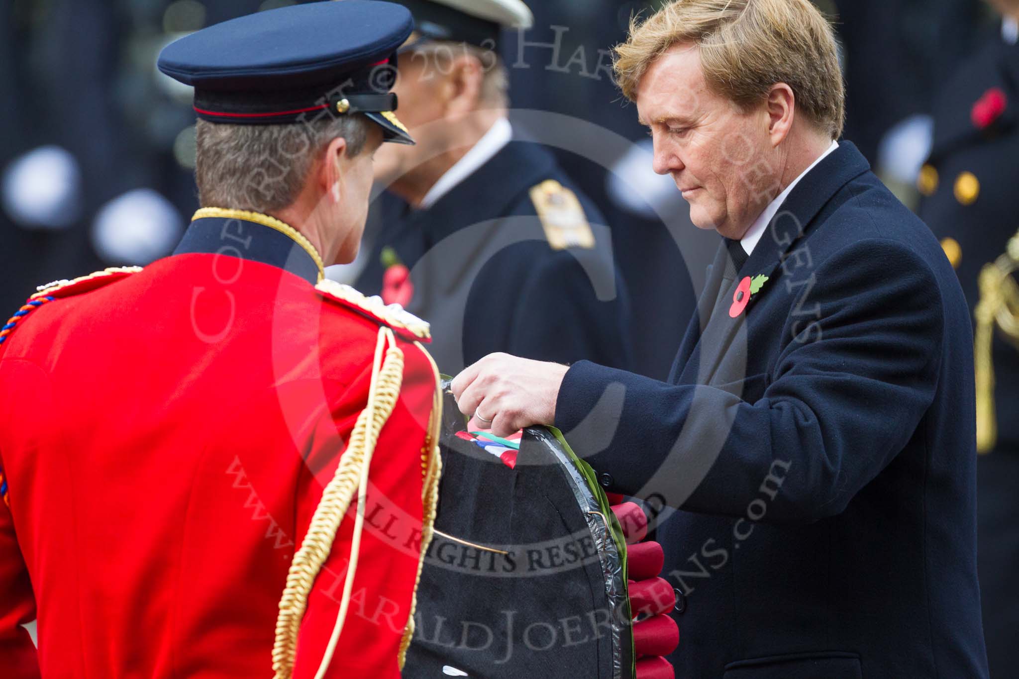 Remembrance Sunday at the Cenotaph 2015: HM The King of the Netherlands reveiving his wreath from his equerry, Major-General  Hans  van  der  Louw. Image #180, 08 November 2015 11:04 Whitehall, London, UK