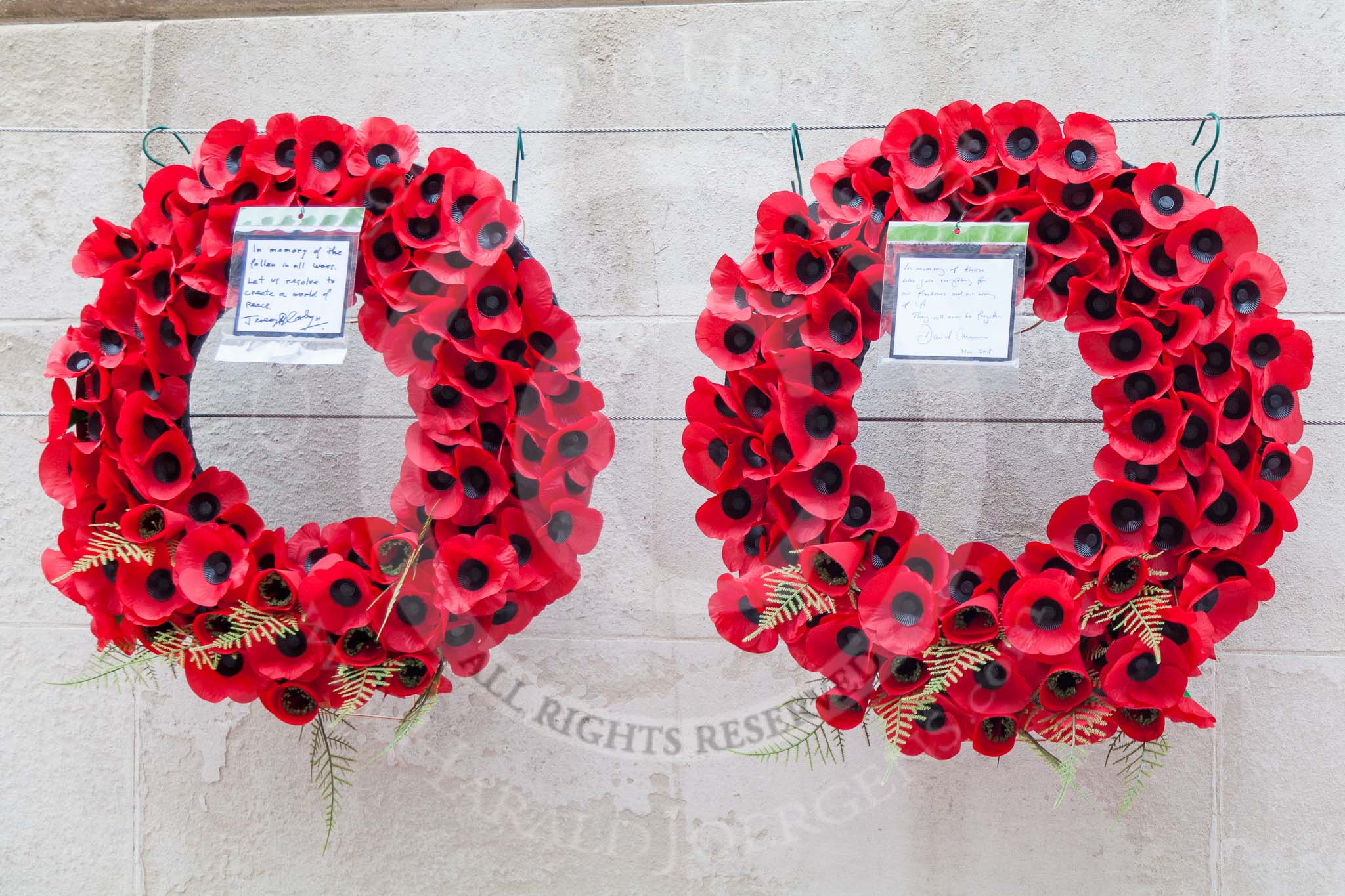 Remembrance Sunday at the Cenotaph 2015: David Cameron's and Jeremy Corbyn's wreath. David Cameron: "In memory of those who gave everything for our freedom and our way of life. They will not be forgotten". Jeremy Corbyn: "In memory of the fallen in all wars. Let us resolve to create a world of peace". Image #375, 08 November 2015 12:41 Whitehall, London, UK