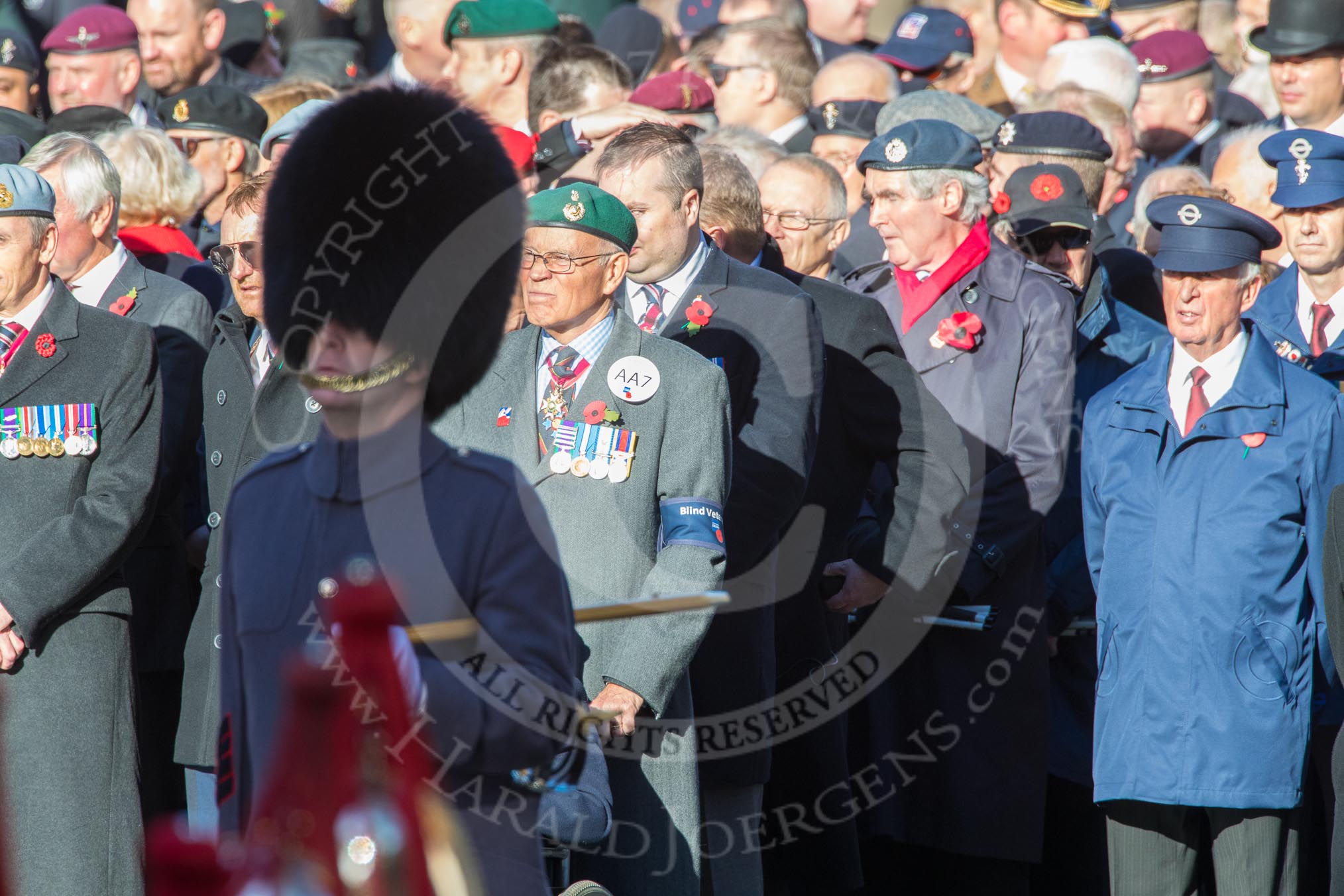 Blind Veterans UK (Group AA7, 215 members) next to the TFL group leading column M before Remembrance Sunday Cenotaph Ceremony 2018 at Horse Guards Parade, Westminster, London, 11 November 2018, 11:31.