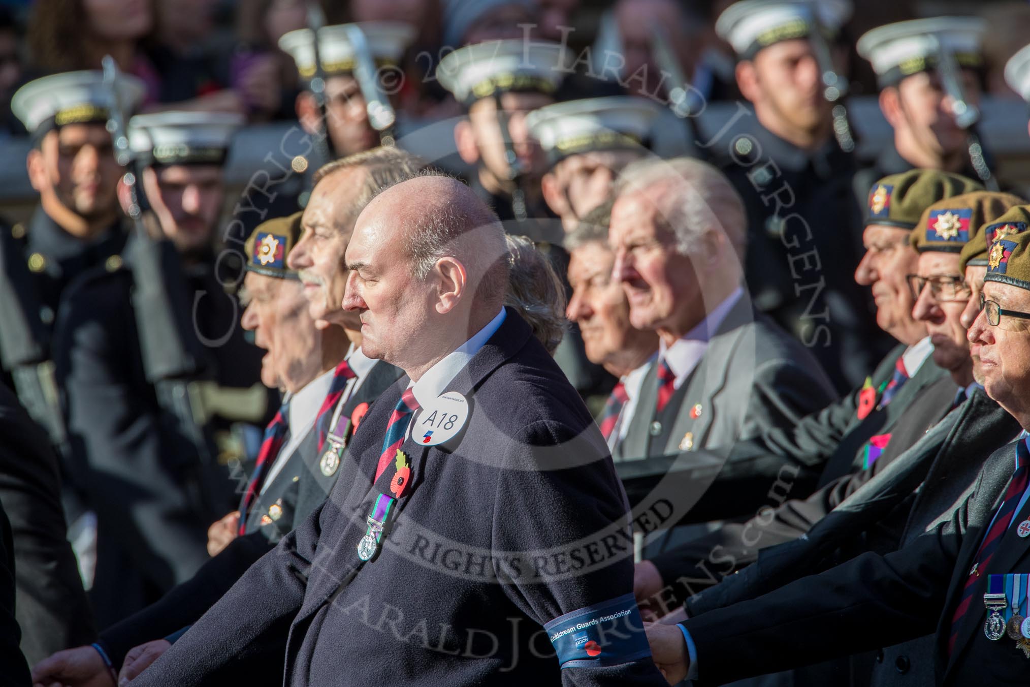 Coldstream Guards Association (Group A18, 30 members) during the Royal British Legion March Past on Remembrance Sunday at the Cenotaph, Whitehall, Westminster, London, 11 November 2018, 11:58.