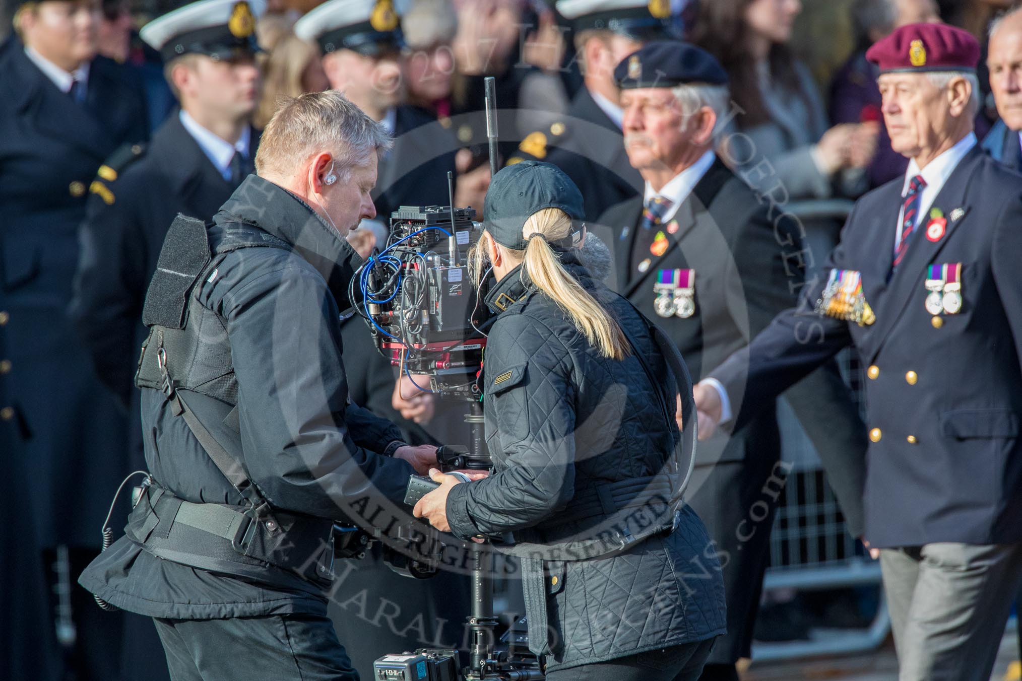The BBC steadycam team with the approaching Royal Army Ordnance Corps Association (Group B1, 33 members) during the Royal British Legion March Past on Remembrance Sunday at the Cenotaph, Whitehall, Westminster, London, 11 November 2018, 12:05.