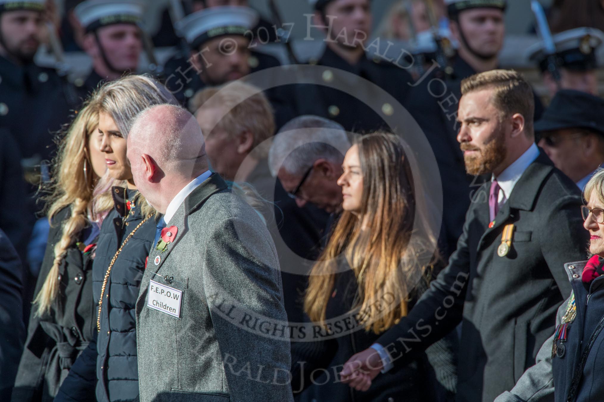 Children (and Families) of Far East Prisoners of War (Group M2, 59 members) during the Royal British Legion March Past on Remembrance Sunday at the Cenotaph, Whitehall, Westminster, London, 11 November 2018, 12:25.