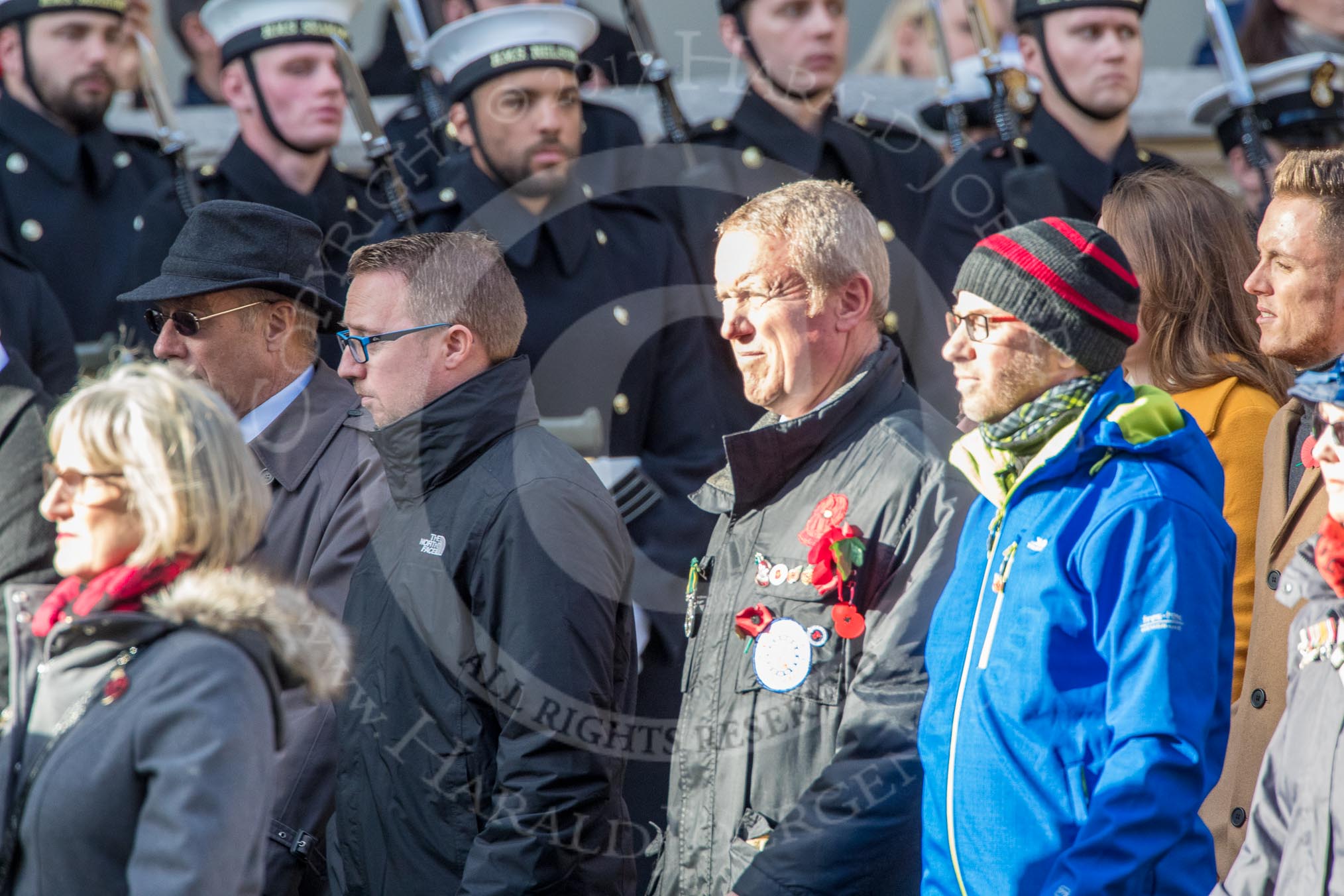 Children (and Families) of Far East Prisoners of War (Group M2, 59 members) during the Royal British Legion March Past on Remembrance Sunday at the Cenotaph, Whitehall, Westminster, London, 11 November 2018, 12:25.
