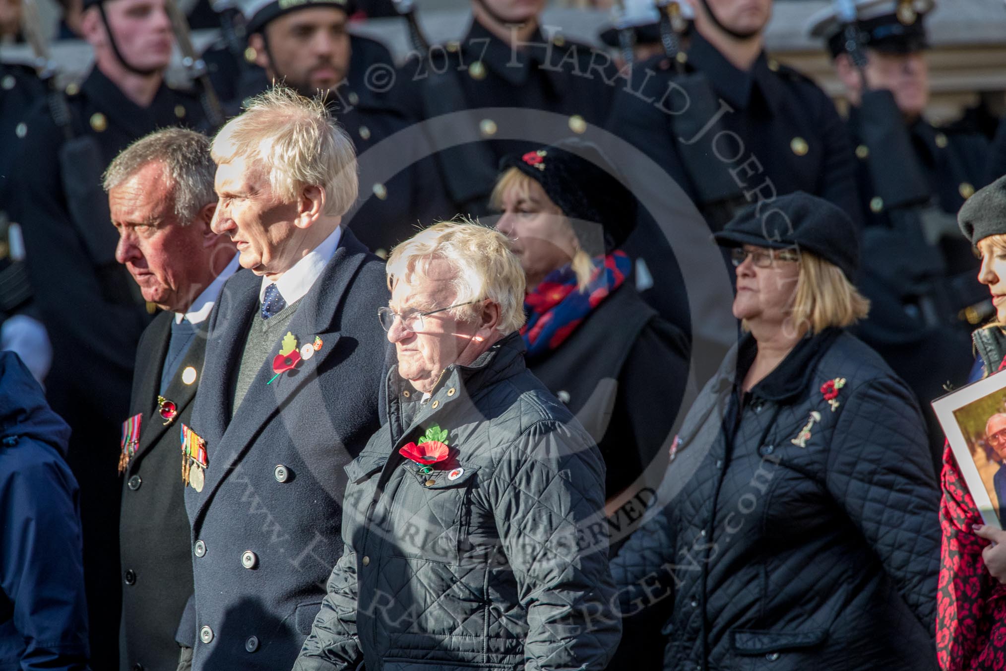 Children (and Families) of Far East Prisoners of War (Group M2, 59 members) during the Royal British Legion March Past on Remembrance Sunday at the Cenotaph, Whitehall, Westminster, London, 11 November 2018, 12:25.