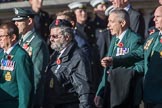 Fleet Air Arm Junglies Association  (Group E12, 22 members) during the Royal British Legion March Past on Remembrance Sunday at the Cenotaph, Whitehall, Westminster, London, 11 November 2018, 11:43.
