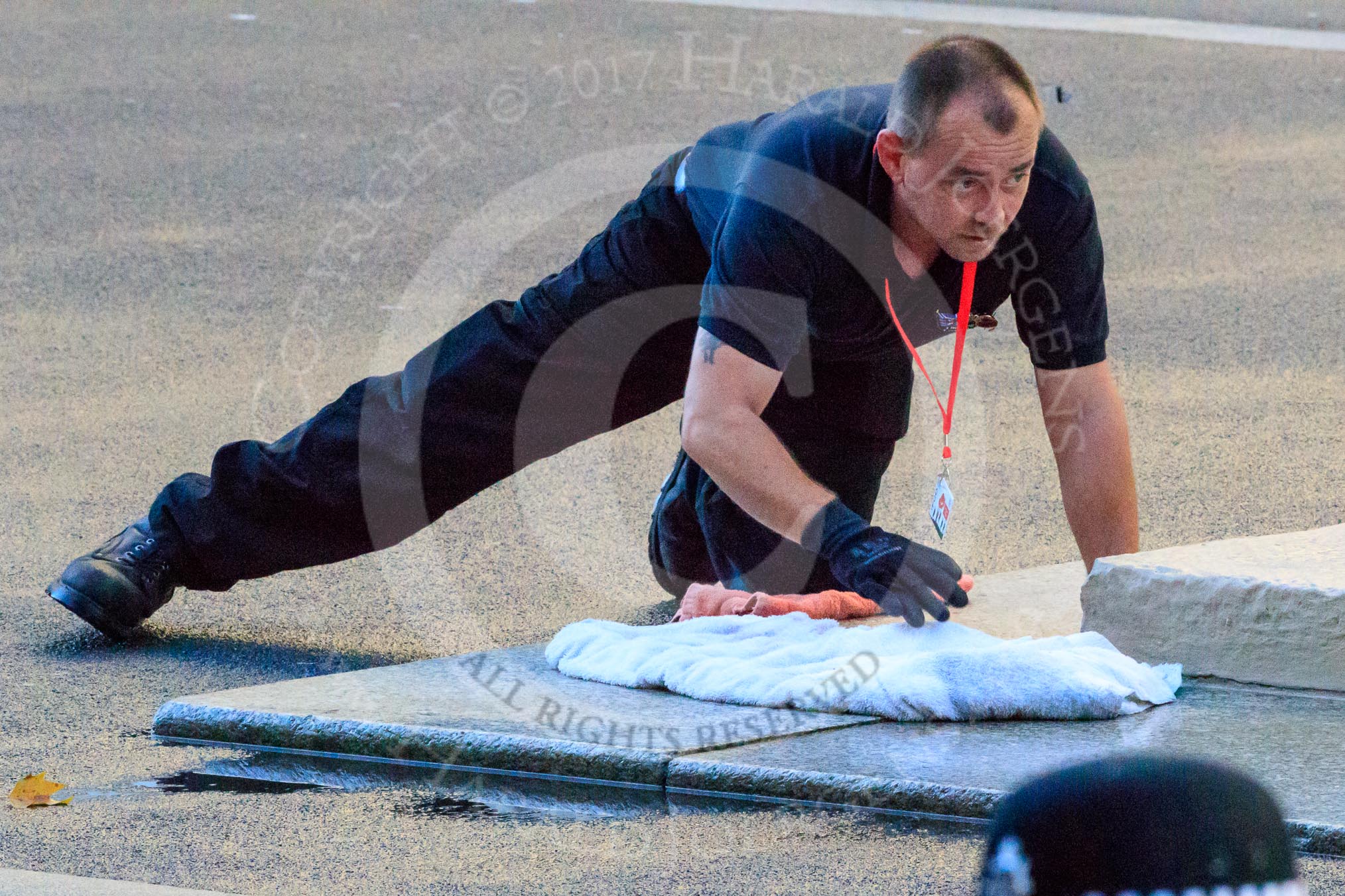 The spaces for the wreaths around the Cenotaph are cleaned before the Remembrance Sunday Cenotaph Ceremony 2018 at Horse Guards Parade, Westminster, London, 11 November 2018, 08:28.