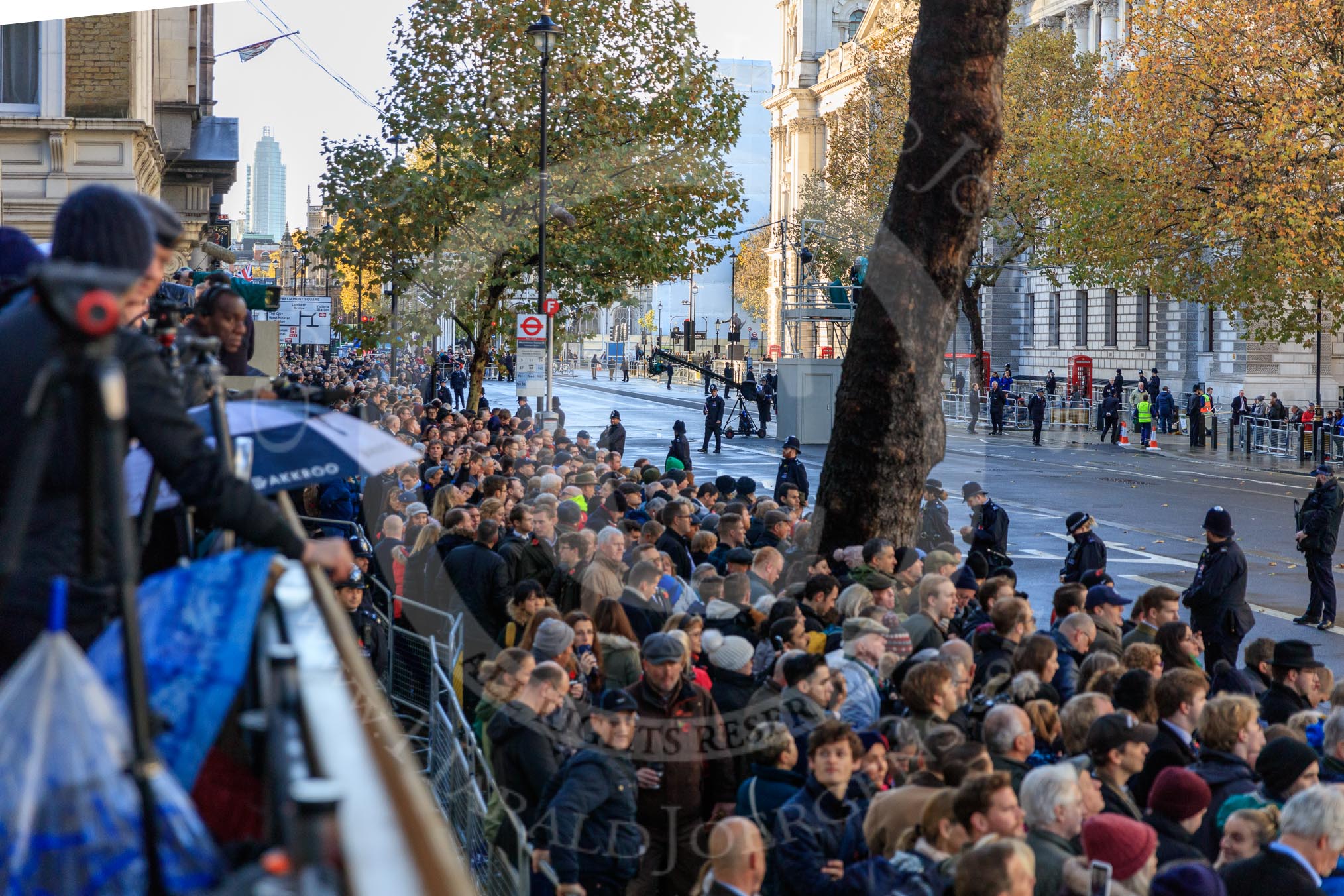 Crowds of spectators are building on on Whitehall before the  Remembrance Sunday Cenotaph Ceremony 2018 at Horse Guards Parade, Westminster, London, 11 November 2018, 08:38.