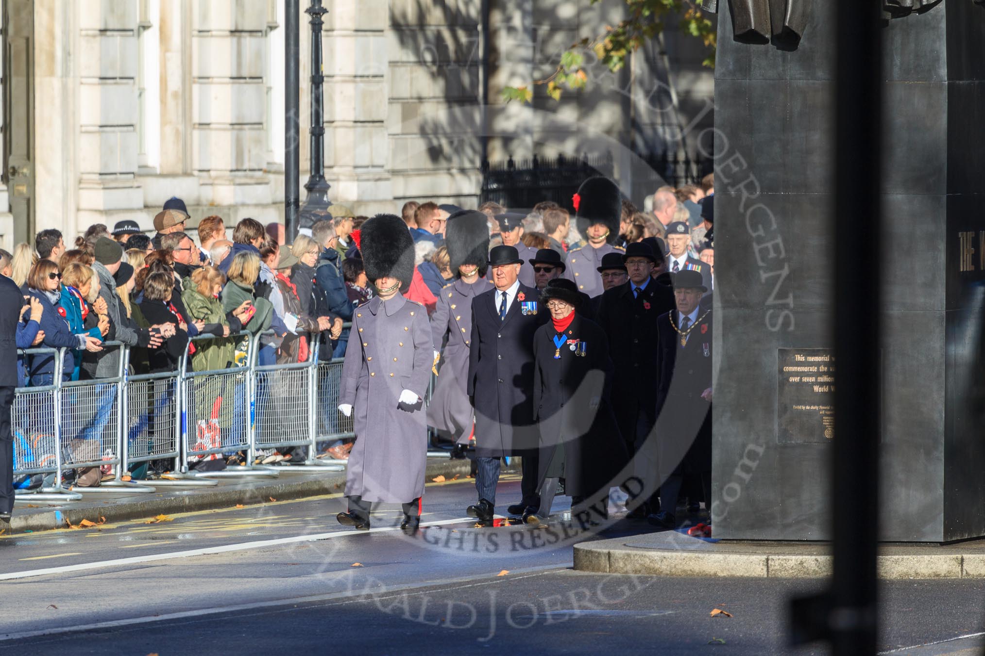 The first group of the March Past, I believe RBL officials, is waiting next to the Memorial for Women in World War II before the Remembrance Sunday Cenotaph Ceremony 2018 at Horse Guards Parade, Westminster, London, 11 November 2018, 10:07.