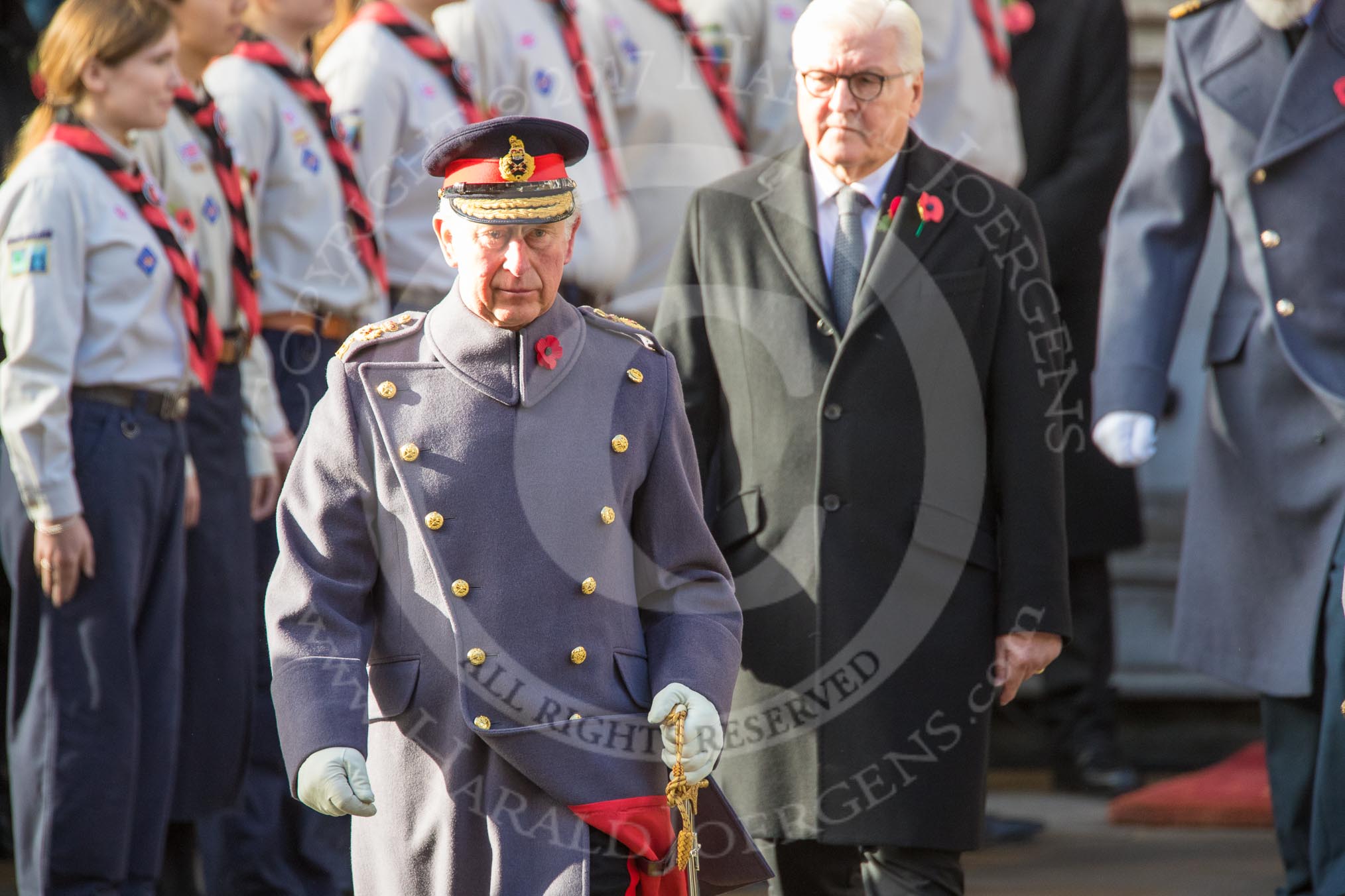 HRH The Prince of Wales (Prince Charles) lays a wreath on behalf of HM The Queen and HE The President of the Federal Republic of Germany, Frank-Walter Steinmeier  leaving the Foreign and Commonwealth Office during the Remembrance Sunday Cenotaph Ceremony 2018 at Horse Guards Parade, Westminster, London, 11 November 2018, 10:58.