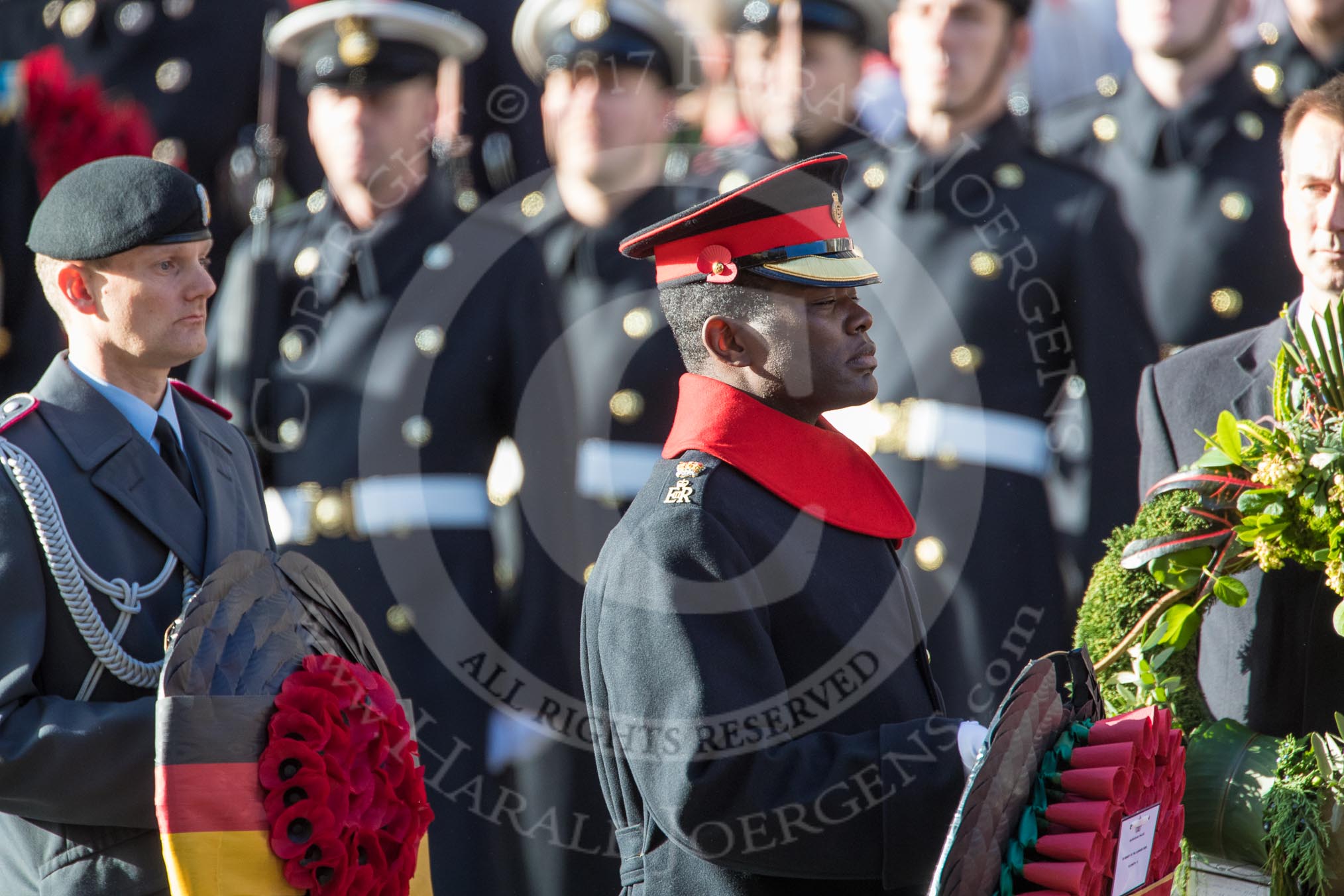 Lieutenant Colonel (German: Oberstleutnant) Christoph Kahnert, Equerry to HE The President of the Federal Republic of Germany,  and Major Nana Twumasi-­Ankrah, Equerry to HM The Queen, during the Remembrance Sunday Cenotaph Ceremony 2018 at Horse Guards Parade, Westminster, London, 11 November 2018, 10:59.