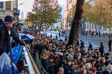 Crowds of spectators are building on on Whitehall before the  Remembrance Sunday Cenotaph Ceremony 2018 at Horse Guards Parade, Westminster, London, 11 November 2018, 08:38.