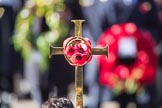 The cross with the poppies, held by the Cross­Bearer, Michael Clayton Jolly, during Remembrance Sunday Cenotaph Ceremony 2018 at Horse Guards Parade, Westminster, London, 11 November 2018, 10:58.