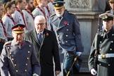 HE The President of the Federal Republic of Germany, Frank-Walter Steinmeier, in focus, between HRH The Prince of Wales (Prince Charles) and HRH The Duke of Kent (Prince Edward) during the Remembrance Sunday Cenotaph Ceremony 2018 at Horse Guards Parade, Westminster, London, 11 November 2018, 10:58.