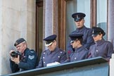 A team of army officers controlling the event's music (?), and an army photographer, on a top floor window of teh Foreign and Commonwealth Office during the Remembrance Sunday Cenotaph Ceremony 2018 at Horse Guards Parade, Westminster, London, 11 November 2018, 11:19.