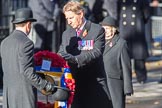 ??? hand the wreath on behalf of Royal British Legion to ???during Remembrance Sunday Cenotaph Ceremony 2018 at Horse Guards Parade, Westminster, London, 11 November 2018, 11:27. Text: THE LEGION OF THE LIVING SALUTES THE LEGION OF THE DEAD