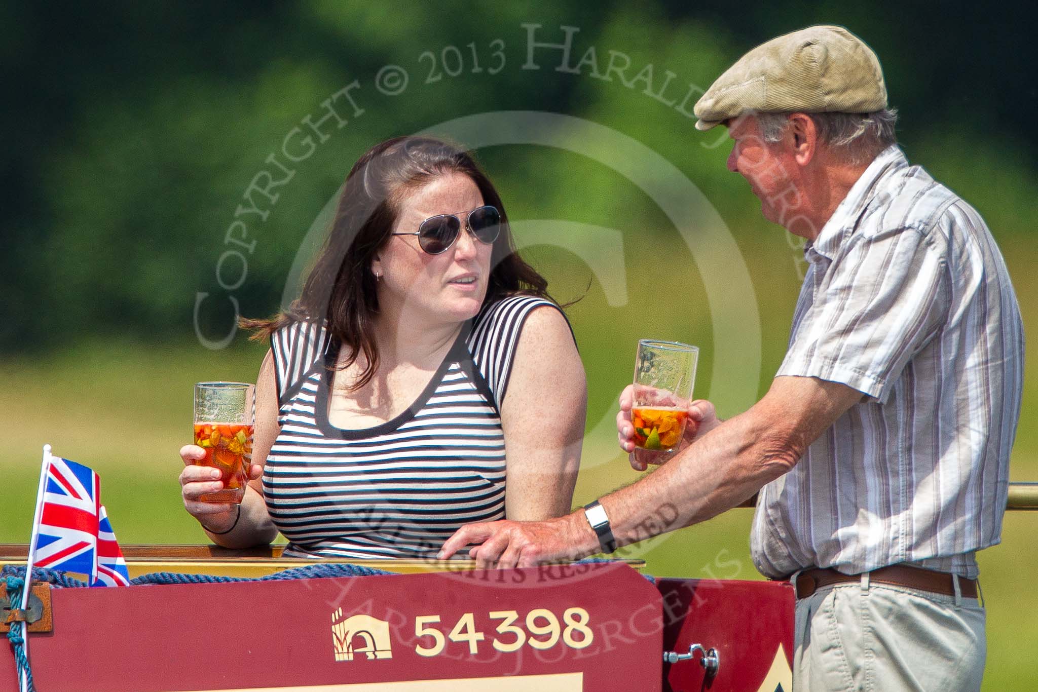 Henley Royal Regatta 2013, Saturday: Pimm's on board of the passing narrowboat Gee-Jay. Image #241, 06 July 2013 11:50 River Thames, Henley on Thames, UK