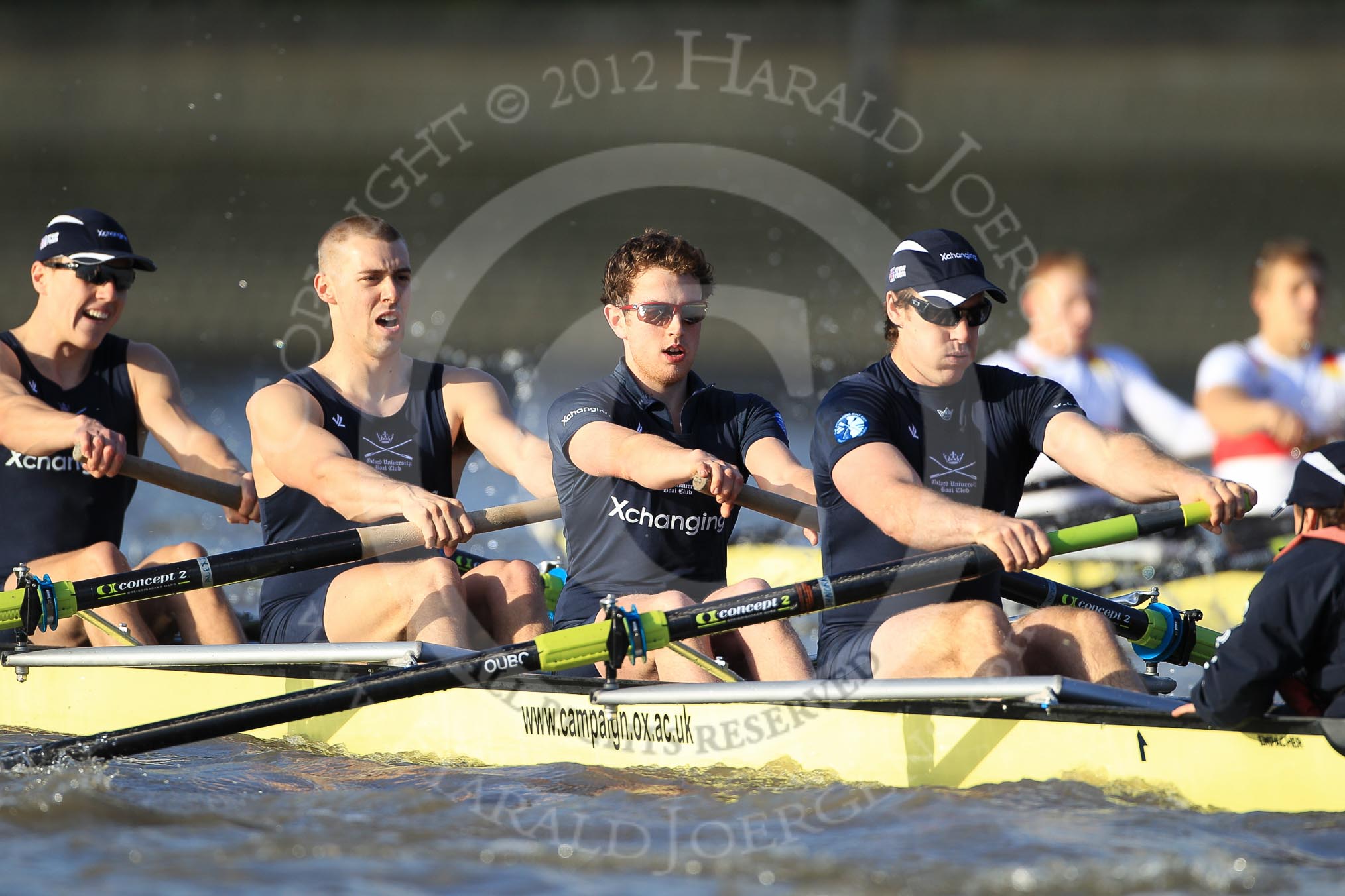 The Boat Race season 2012 - fixture OUBC vs German U23: In front the Oxford Blue Boat, from left to right Karl Hudspith, Alex Davidson, Dan Harvey, Stern Roel Haen, and cox Zoe de Toledo, behind, in the German U23 boat, bow Maximilian Johanning and Rene Stüven..
River Thames between Putney and Mortlake,
London,

United Kingdom,
on 26 February 2012 at 15:26, image #53