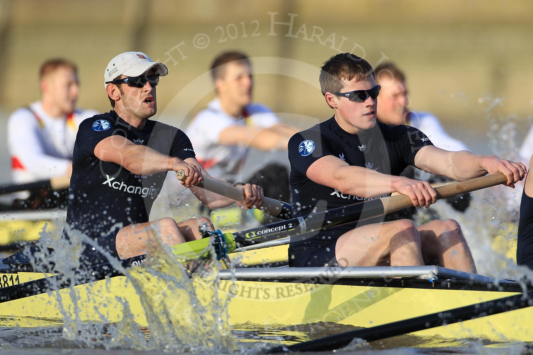 The Boat Race season 2012 - fixture OUBC vs German U23: The Oxford Blue Boat - bow Dr. Alexander Woods and Geordie MacLeod, behind, in the German U23 boat, bow Maximilian Johanning, Rene Stüven, and Robin Ponte..
River Thames between Putney and Mortlake,
London,

United Kingdom,
on 26 February 2012 at 15:28, image #59