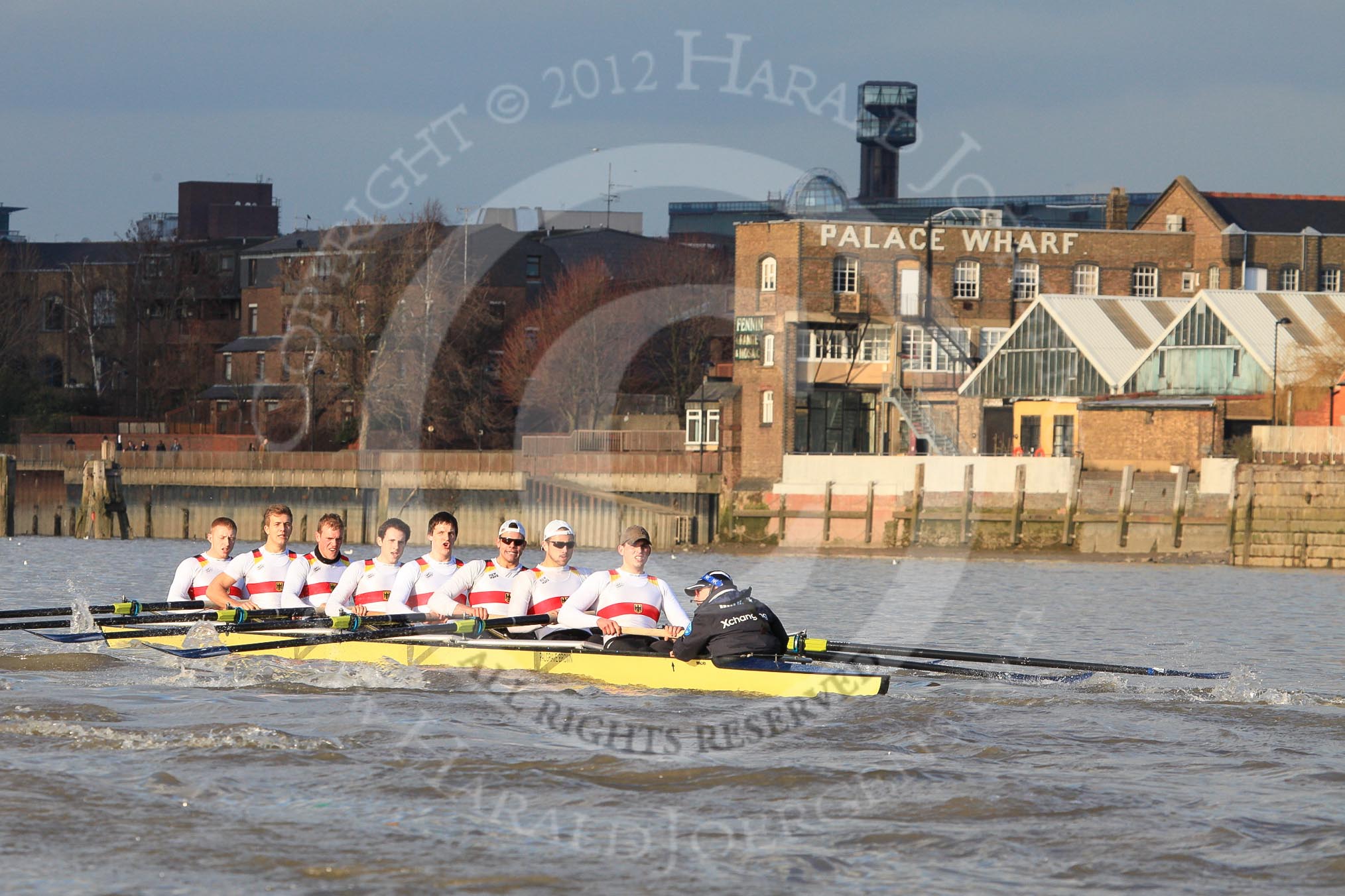 The Boat Race season 2012 - fixture OUBC vs German U23: The German U23 boat, bow Maximilian Johanning, Rene Stüven, Robin Ponte, Alexander Thierfelder, Malte Jakschik, Maximilian Planer, Felix Wimberger, stern Lukas-Frederik Müller, cox Oskar Zorilla, on the Thames at Palace Wharf Studios, approaching Hammersmith Bridge..
River Thames between Putney and Mortlake,
London,

United Kingdom,
on 26 February 2012 at 15:29, image #64