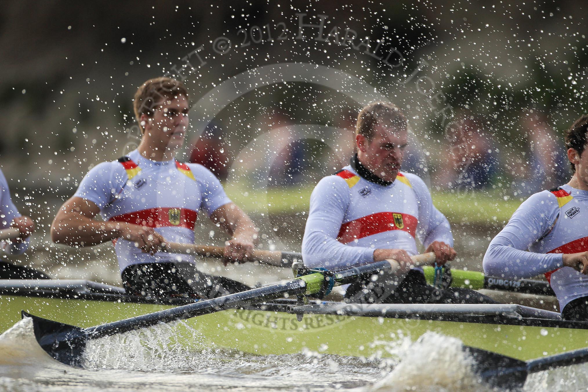 Photo 1202261551401D49187HaraldJoergens The Boat Race season 2012 - fixture OUBC vs German U23: The German U23 boat approaching the finish line for the secon race at Mortlake - Rene Stüven, Robin Ponte, and Alexander Thierfelder..
River Thames between Putney and Mortlake,
London,
United Kingdom,
on 26 February 2012 at 15:51, image #100