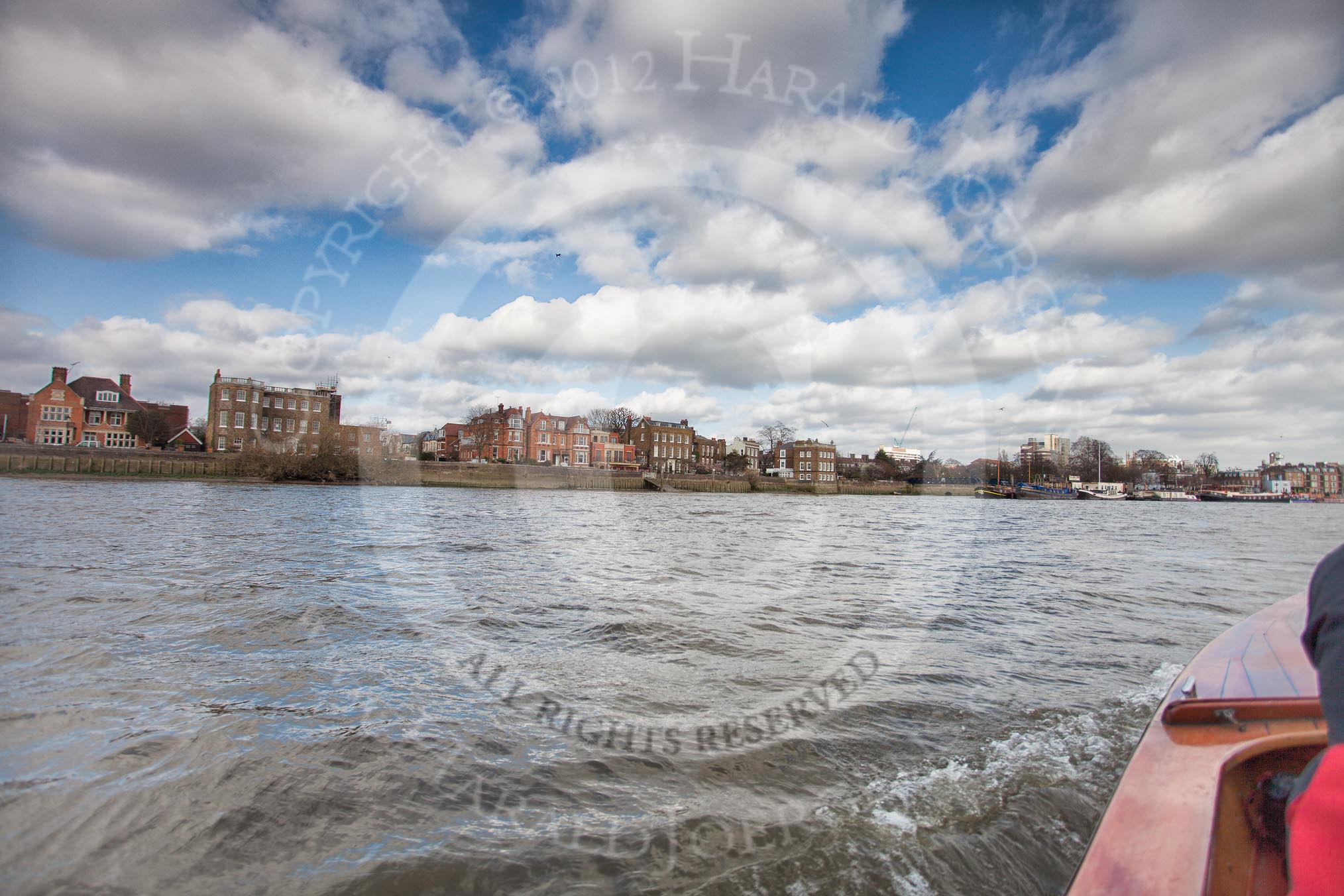 The Boat Race season 2012 - fixture CUBC vs Leander: The press launch, carrying photographers and television crews, returning to base after the CUBC vs Leander fixture, here passing through the Surrey Bend downstream. On the left some nice houses at Upper Mall, London W6..
River Thames between Putney and Molesey,
London,
Greater London,
United Kingdom,
on 10 March 2012 at 14:23, image #151