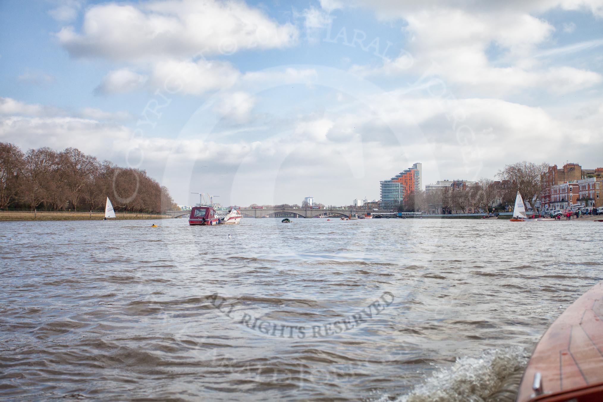 The Boat Race season 2012 - fixture CUBC vs Leander: The press launch, carrying photographers and television crews, returning to base after the CUBC vs Leander fixture, on the way to Putney Bridge..
River Thames between Putney and Molesey,
London,
Greater London,
United Kingdom,
on 10 March 2012 at 14:35, image #154