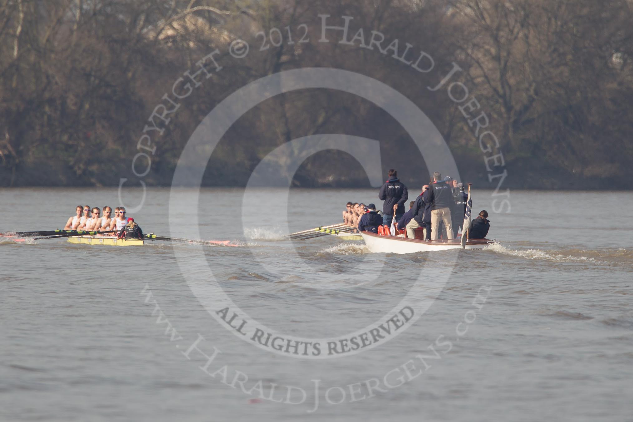 Photo 1203241430451D43013HaraldJoergens The Boat Race season 2012 - fixture OUBC vs Leander: OUBC Blue Boat in the lead - 2 William Zeng, 3 Kevin Baum, 4 Alexander Davidson, 5 Karl Hudspith, 6 Dr. Hanno Wienhausen, 7 Dan Harvey, stroke Roel Haen, cox Zoe de Toledo, in the Leander boat bow Nathan Hillyer, Chris Friend, Will Gray, Sam Whittaker, Tom Clark, John Clay, Cameron MacRitchie, stroke Vasillis Ragoussis, and cox Katie Klavenes. Behind the two boats the umpire Richard Phelps..
on 24 March 2012 at 14:30, image #131