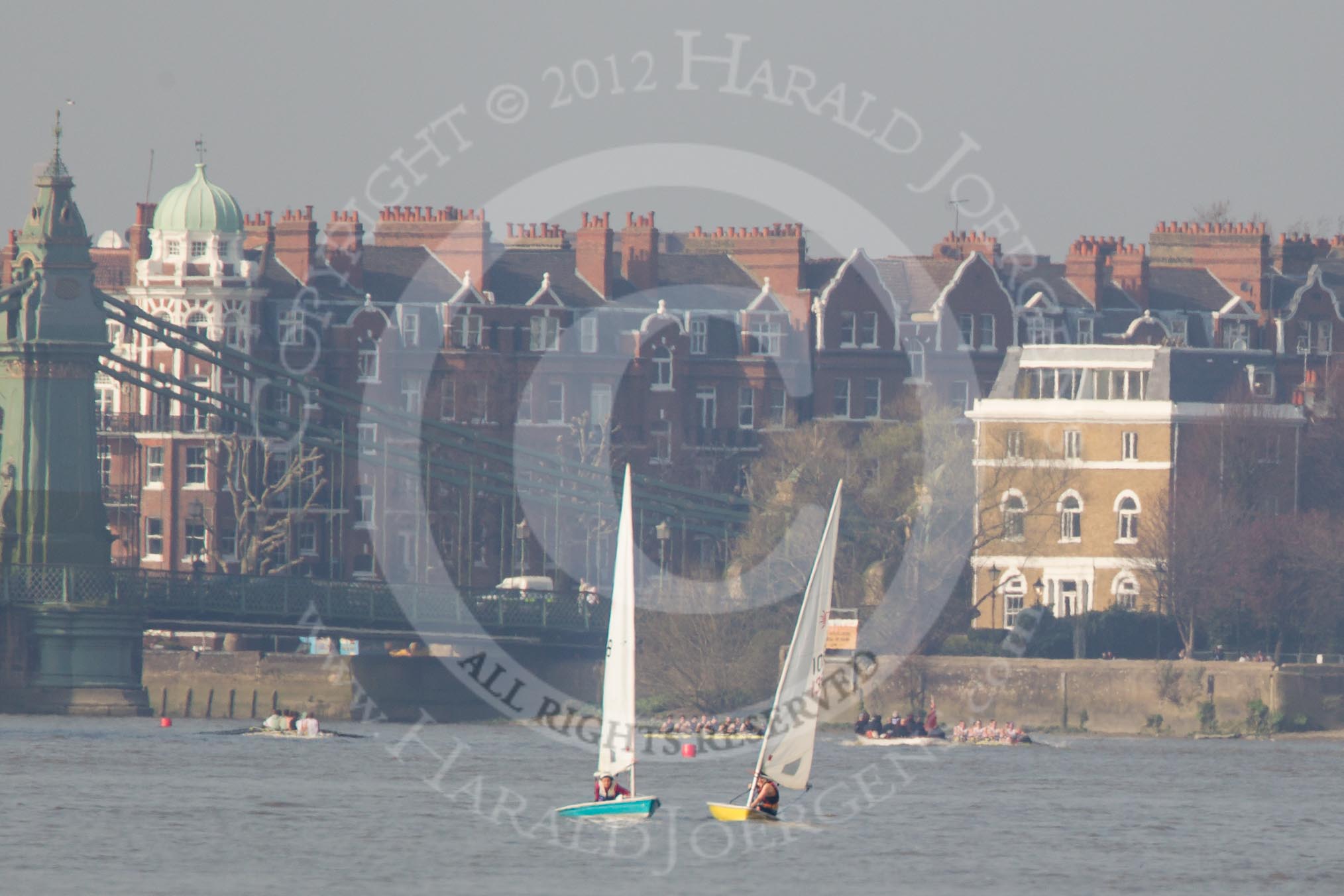 The Boat Race season 2012 - fixture OUBC vs Leander: Approaching Hammersmith Bridge, the OUBC Blue Boat on the right, Leander on the left, both followed by umpire Richard Phelps. Coming the other way, on the left of the image, the Cambridge Blue Boat..




on 24 March 2012 at 14:34, image #150
