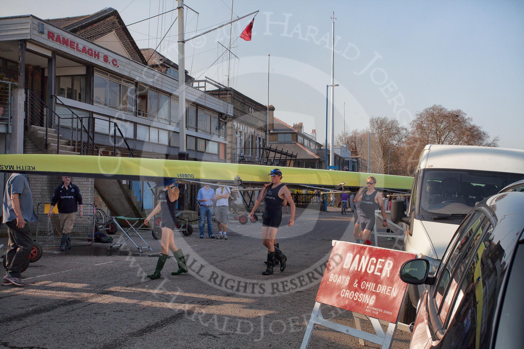 The Boat Race season 2012 - fixture OUBC vs Leander: The OUBC Isis crew accrying the boat back to the boathouse, crossing the Putney Embankment. On the left Oxford Equipment Manager Pat Lockley, carrying the boat Tom Hilton, Chris Fairweather, Julian Bubb-Humfryes, Ben Snodin, and Joe Dawson..




on 24 March 2012 at 14:59, image #155