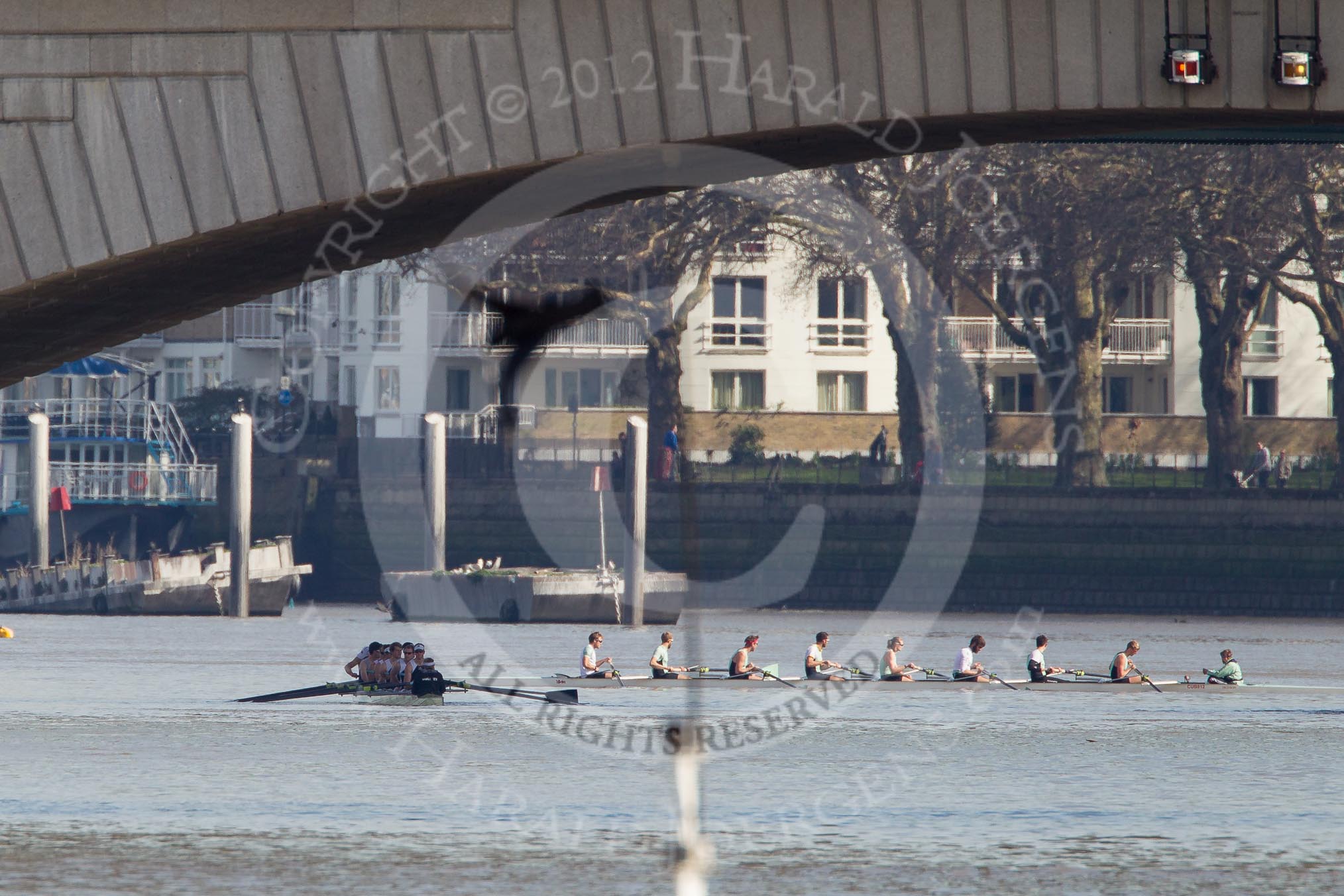 The Boat Race season 2012 - fixture CUBC vs Molesey BC: The CUBC Blue Boat waiting behind Putney Bridge for the start of the fixture against Molesey BC, their boat, in the shadow of Putney Bridge, on the left..




on 25 March 2012 at 15:15, image #96