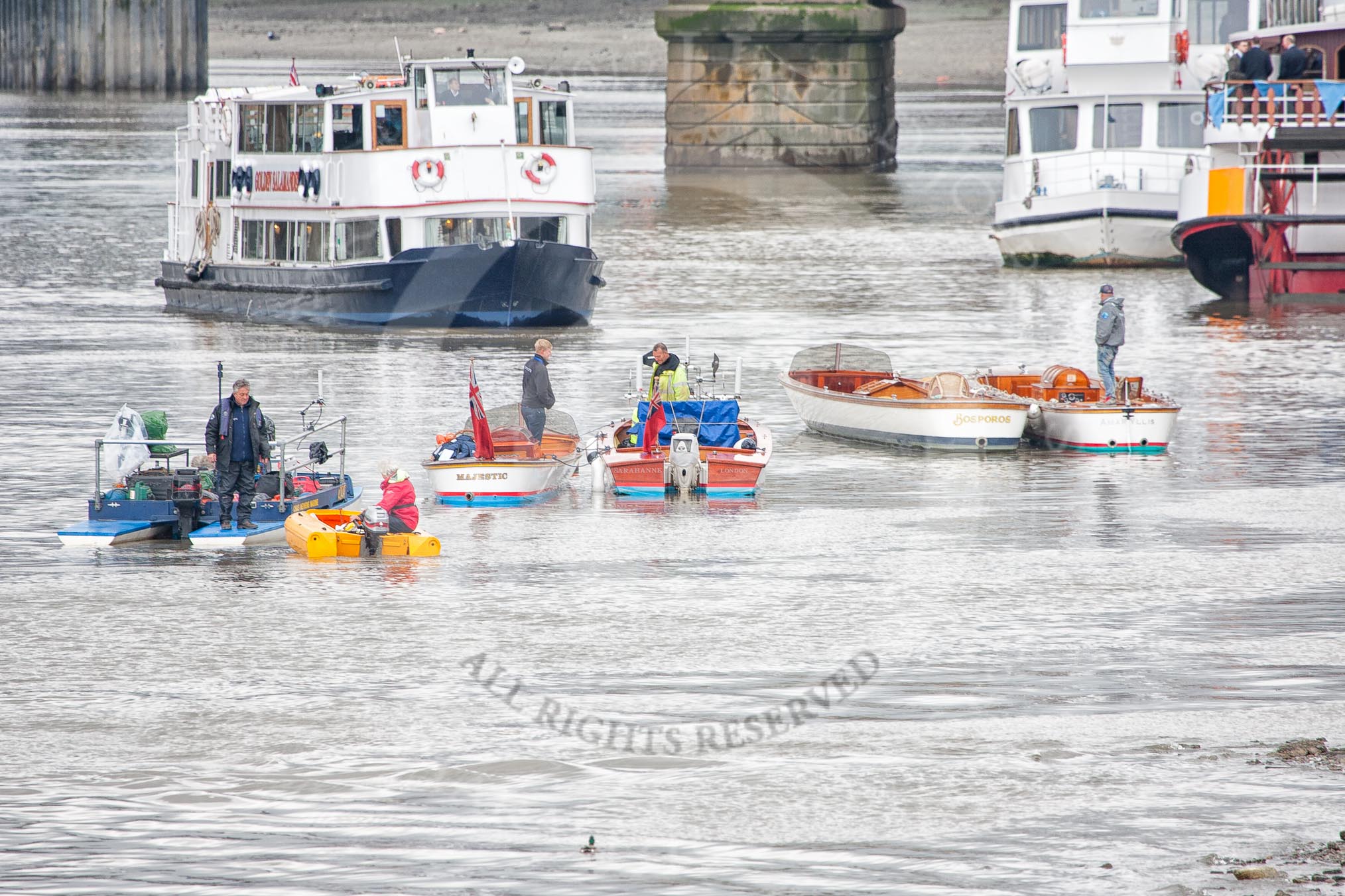 The Boat Race 2012: Setting the scene for the 2012 Boat Race: The flotilla of Thames launches to follow the Boat Race is prepared. In the background Putney Bridge, on the left Golden Salamander, a passenger boat from http://www.ThamesExecutiveCharters.com..




on 07 April 2012 at 11:24, image #20