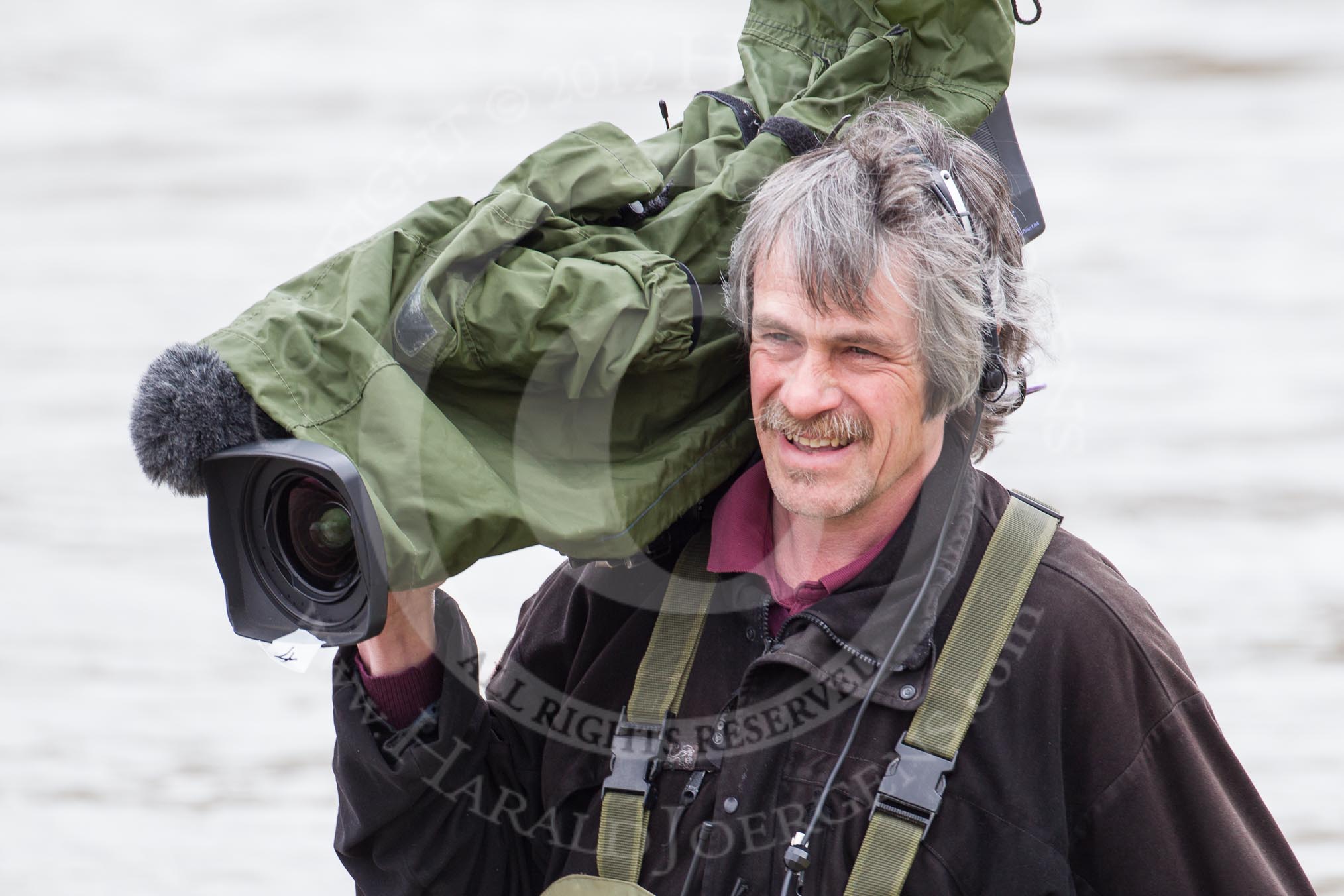 The Boat Race 2012: A BBC Sport/SIS camera man about to walk into the Thames, to capture the Oxford squad get into the OUBC Blue Boat..




on 07 April 2012 at 13:26, image #131