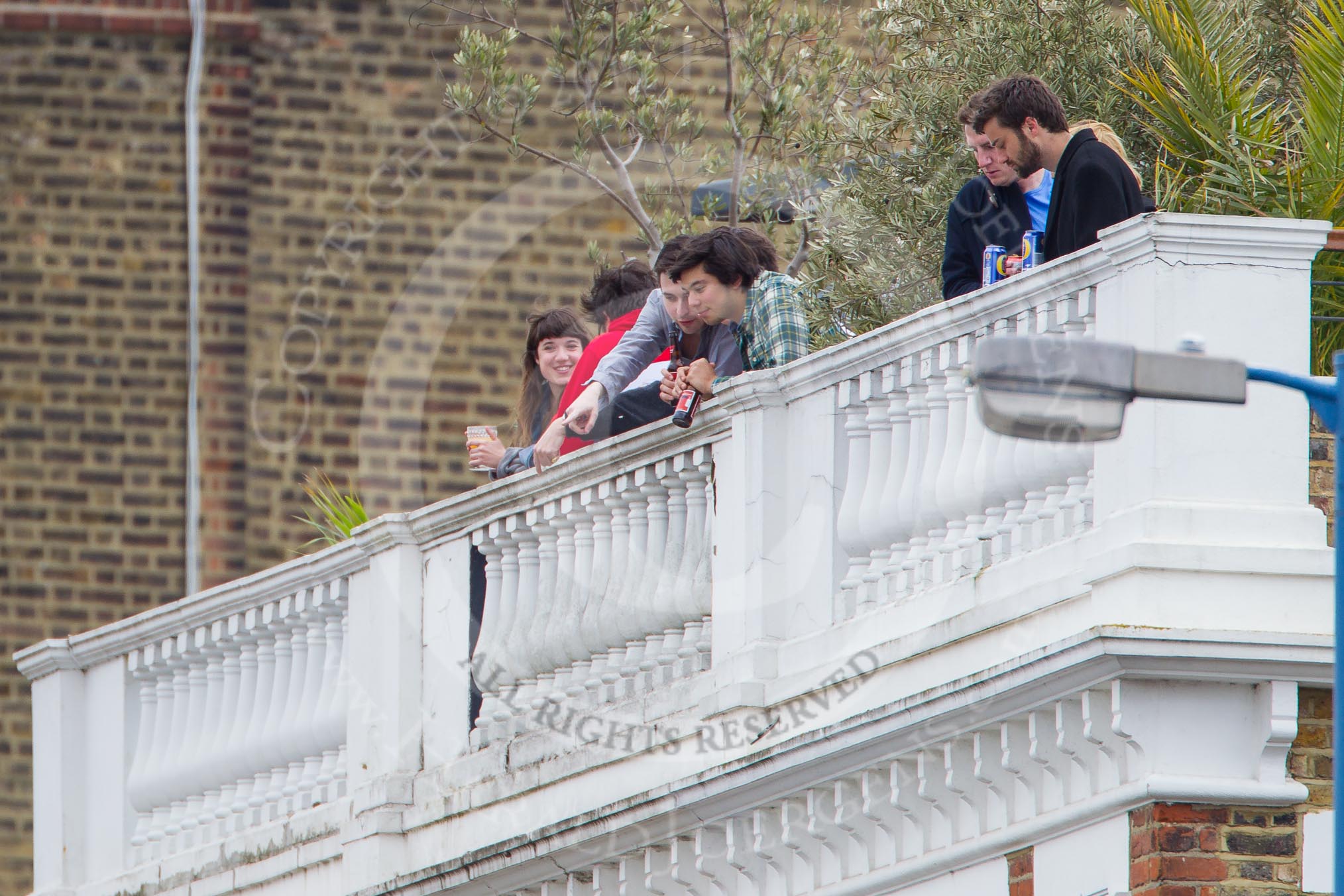 The Boat Race 2012: Spectators waiting for the start of the 2012 Boat Race on the roof of one of the houses on Surrey Embankment..




on 07 April 2012 at 13:55, image #203